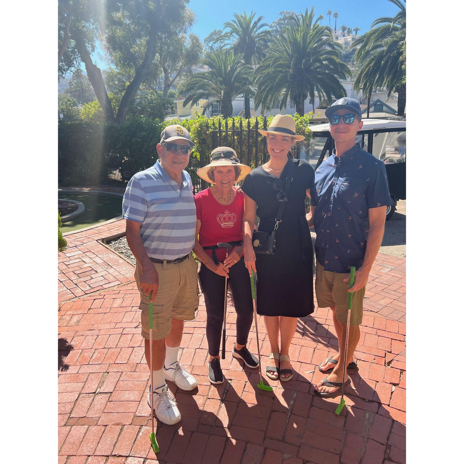 Playing mini golf with Chad's grandparents in Catalina, 2022