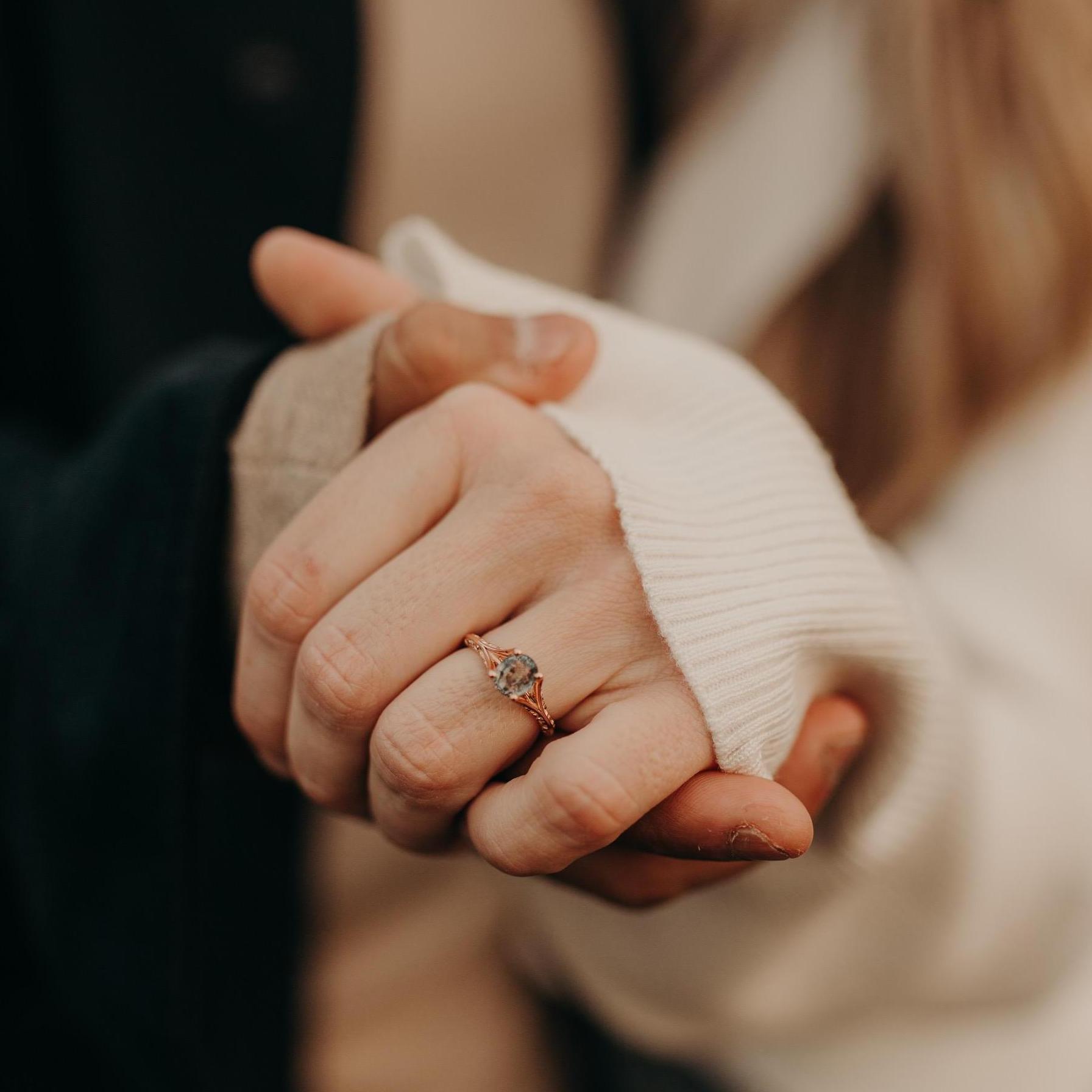 An engagement ring as unique as the couple. The stone is a Montana Sapphire.  Montana is Ashleigh's favorite place in the world and is a tribute to her late grandfather.