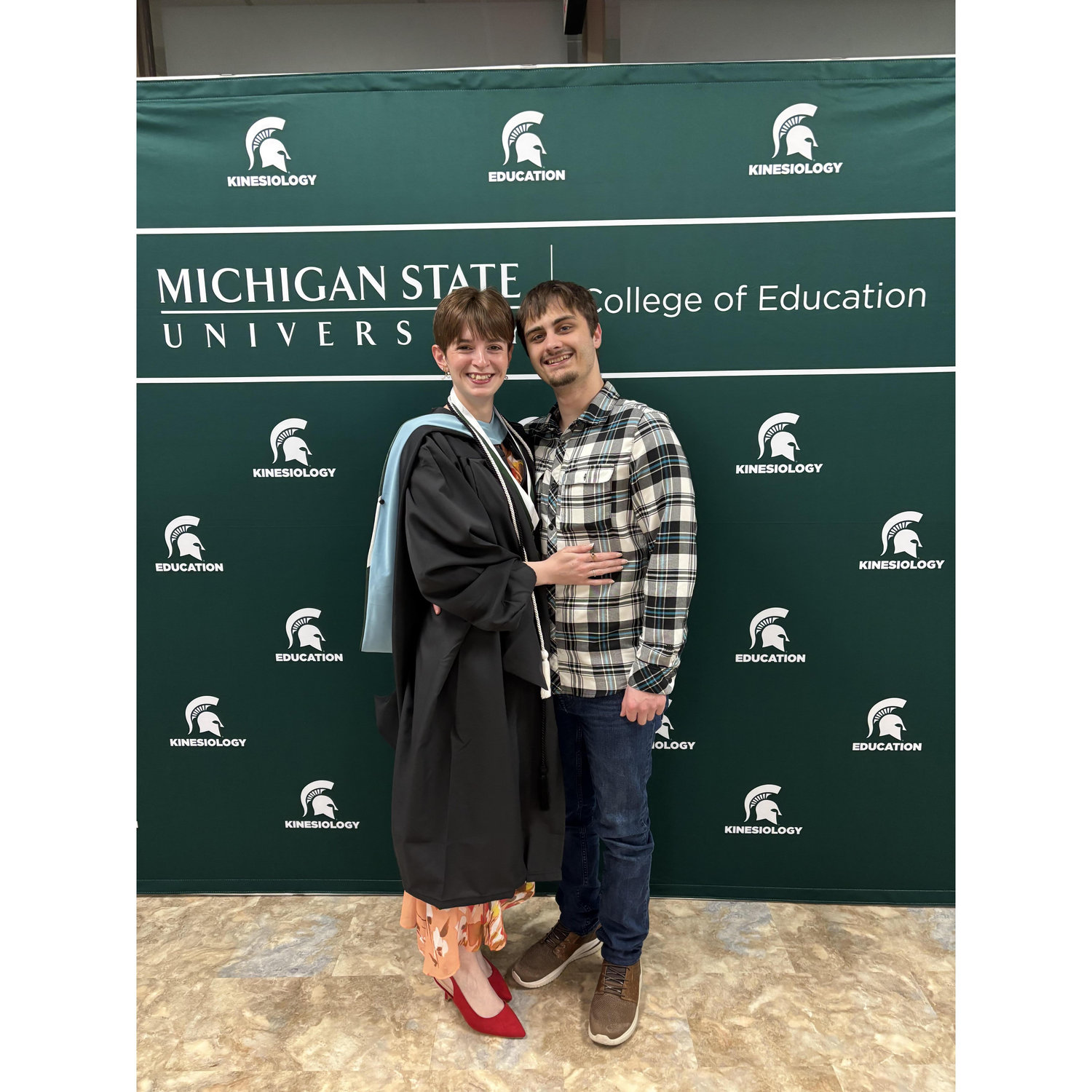 May 2025: Emiley and Logan at her hooding ceremony