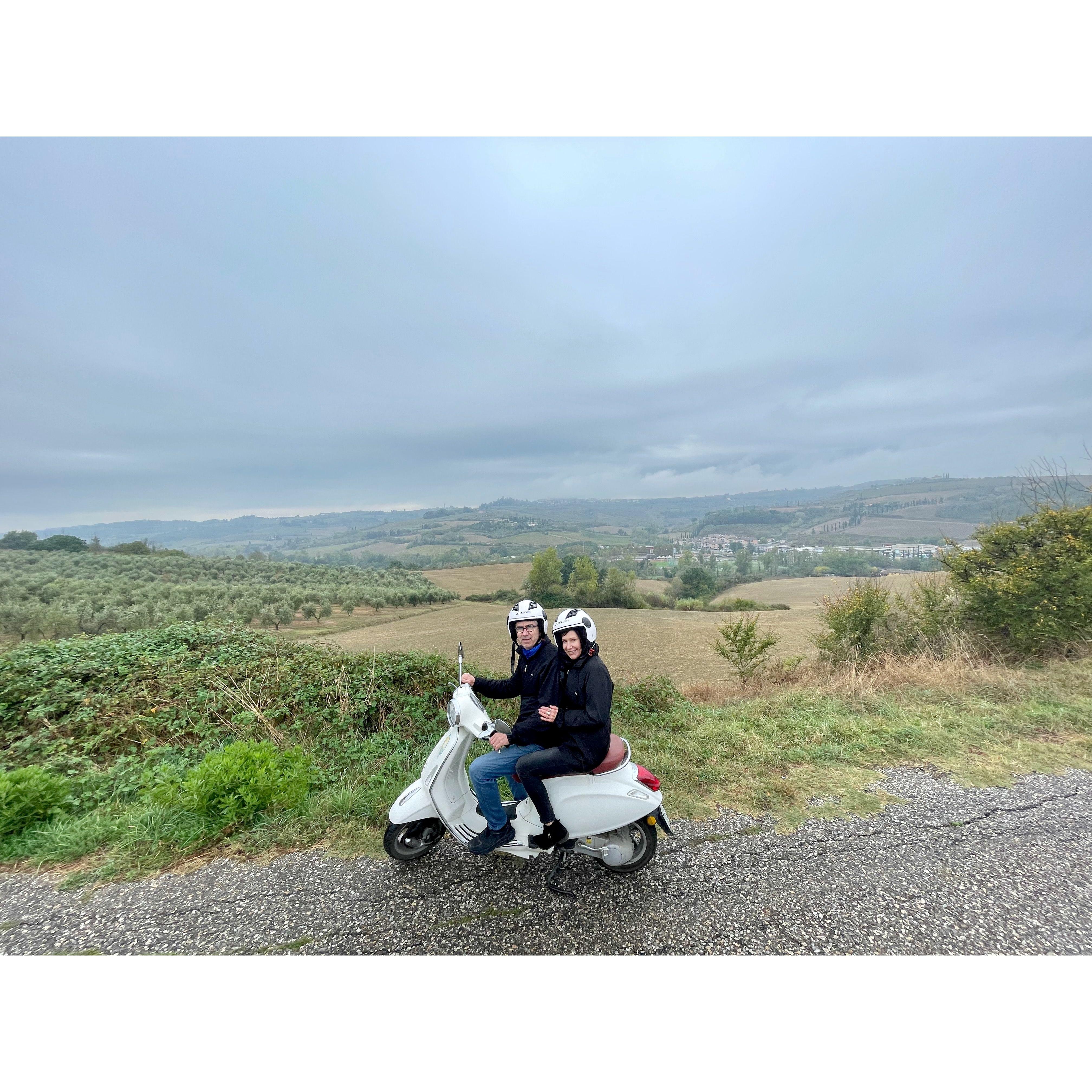 Riding mopeds in Tuscany in a major downpour.