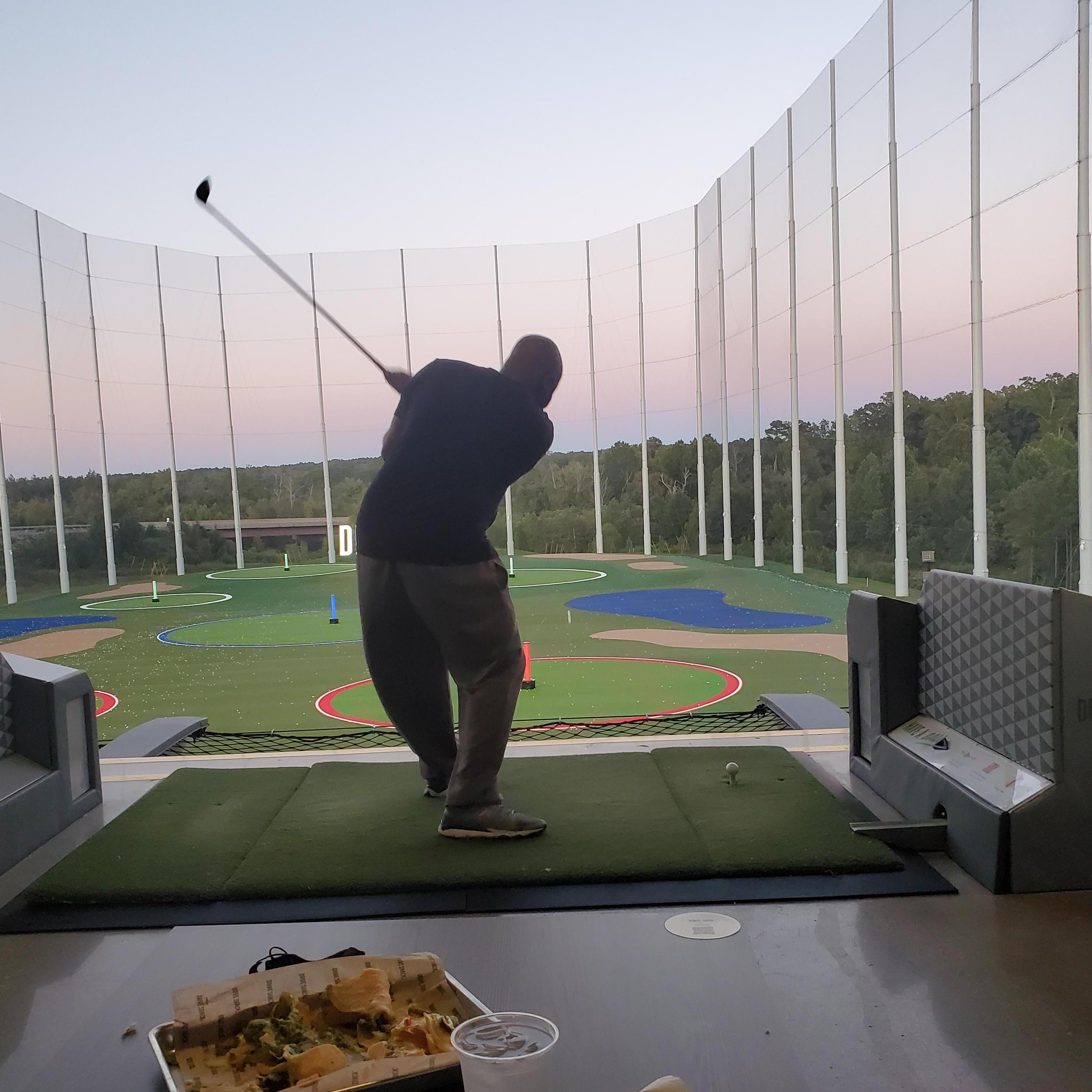 Perfecting that golf swing...LOL (I think he missed)
