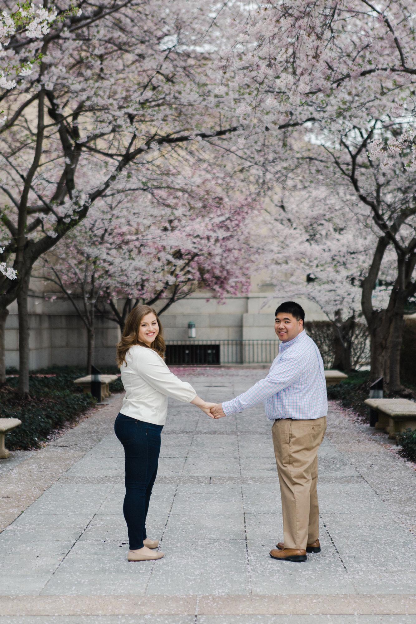 Cherry blossom engagement pictures at the Basilica of the National Shrine of the Immaculate Conception, March 2020. (Kate Grace Photography)