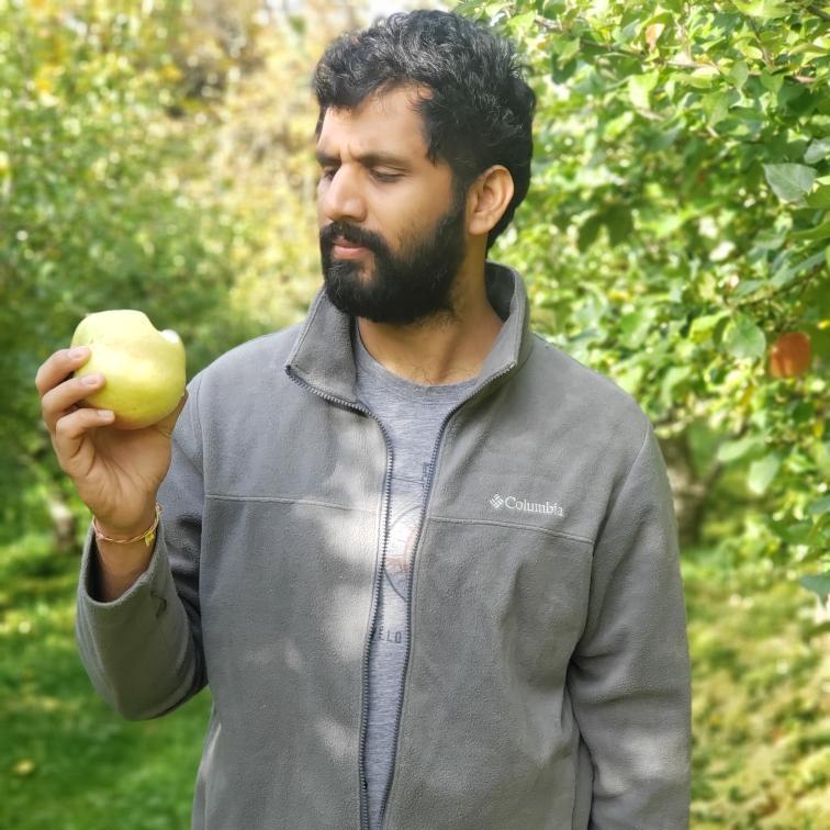 Neil enjoying an apple at Scott Farm. (We promise they're good!) - Oct. 2019