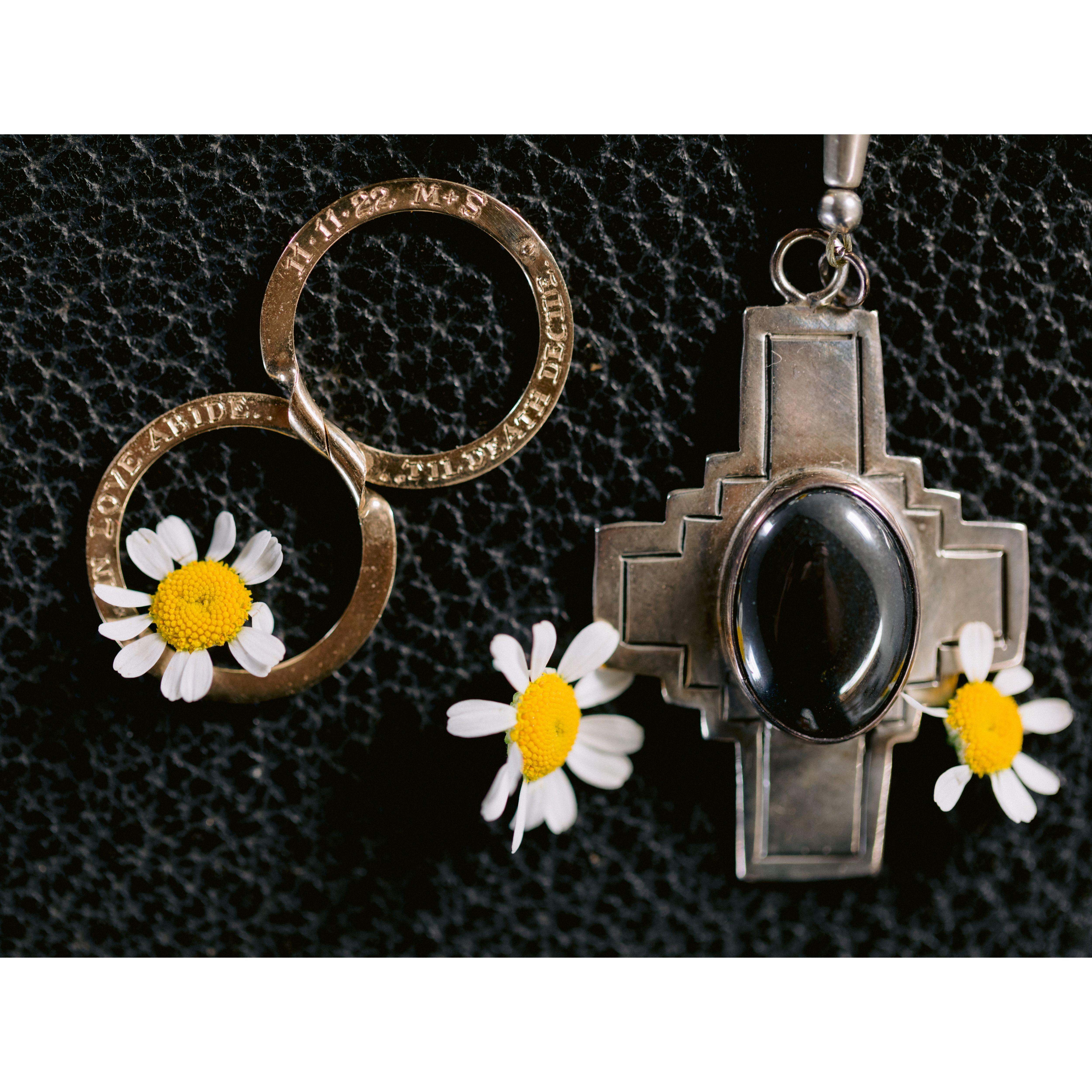 A detail shot of Sara’s special wedding band with Marcus’ handmade rosary from his Uncle Mark. Both sitting on the Bible his grandfather gave his grandmother on their wedding day.