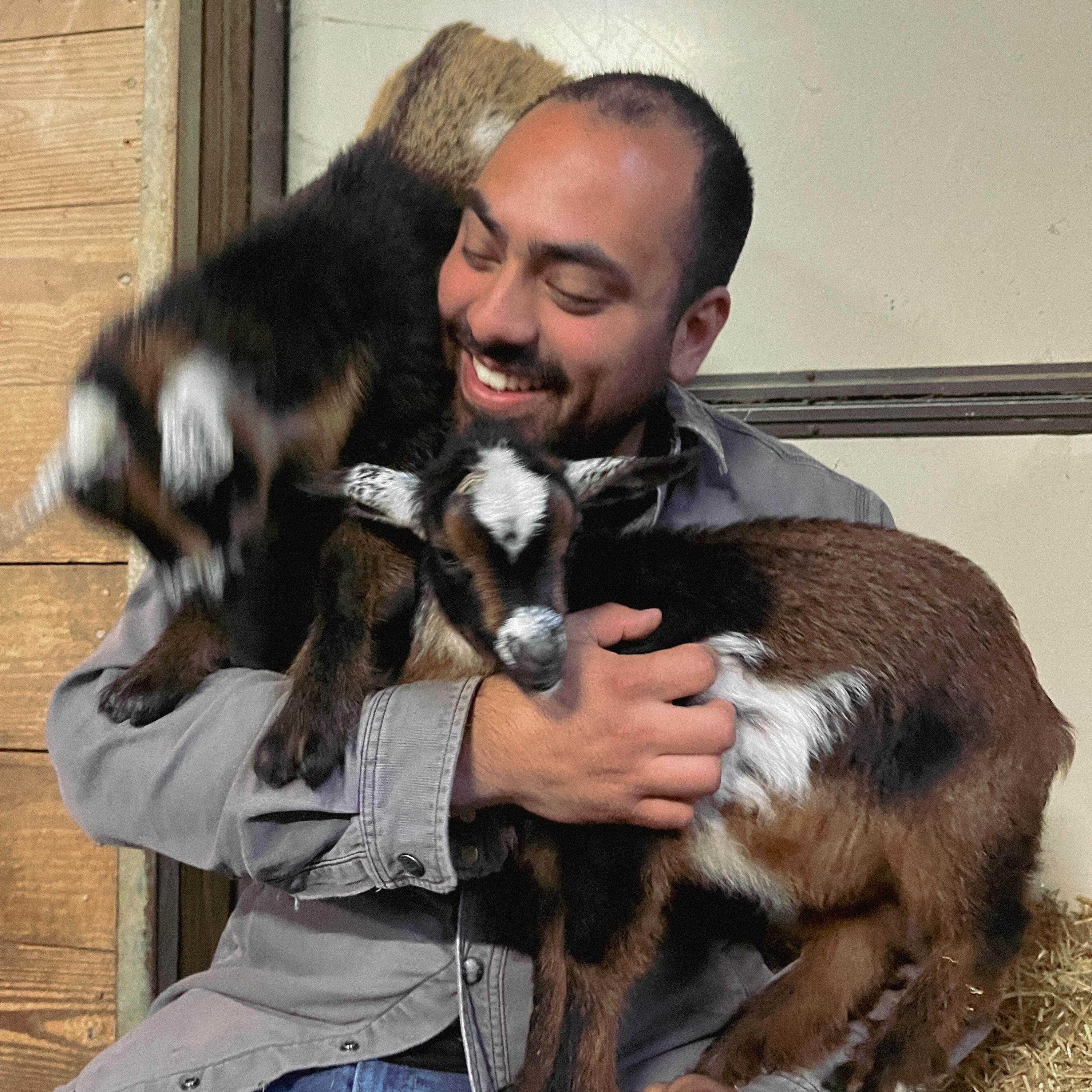 Emiliano with our friend Sue’s baby goats! 2025.