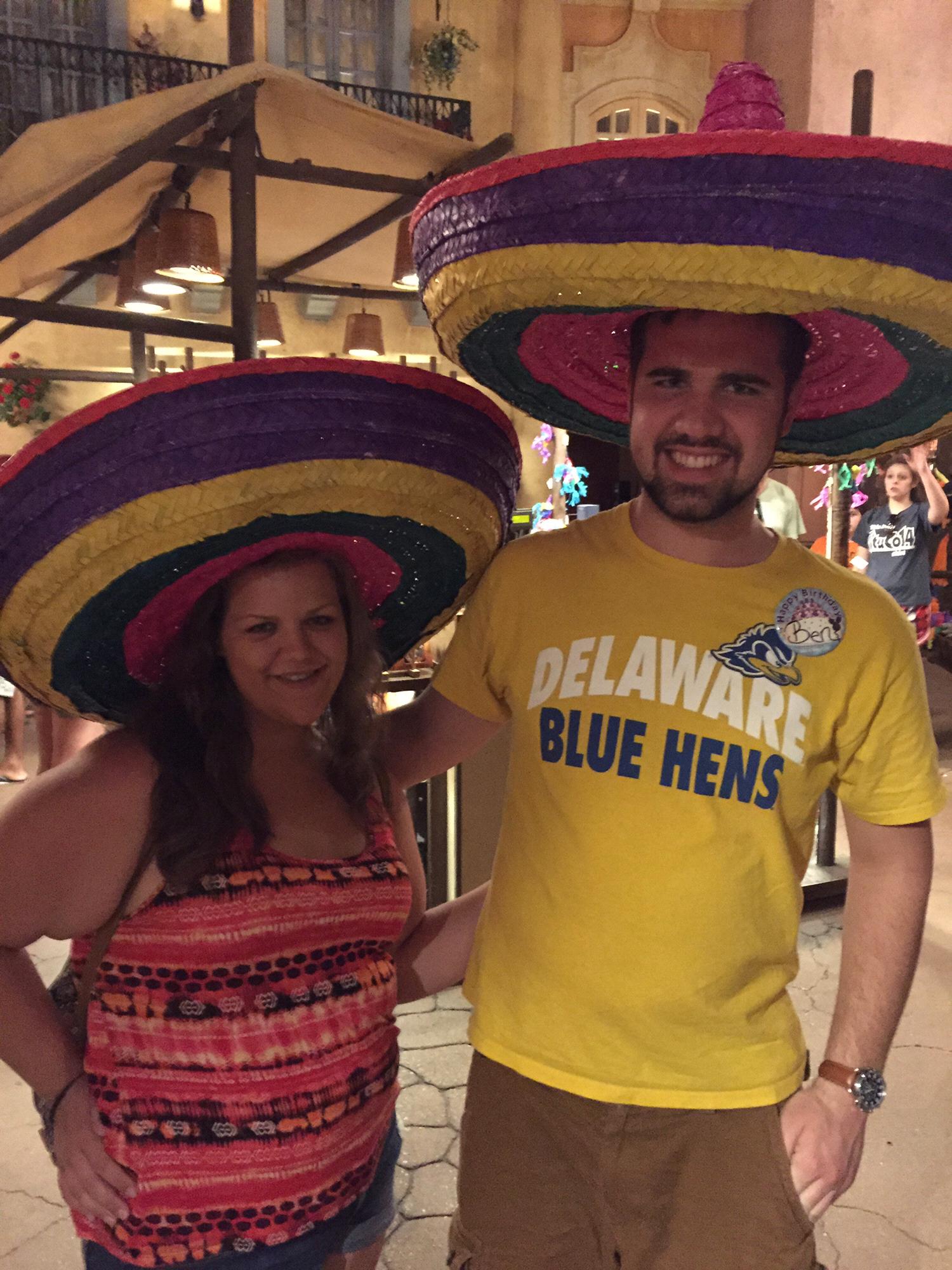 Disney 2015. When the hat is so big you can't get close enough to each other.
