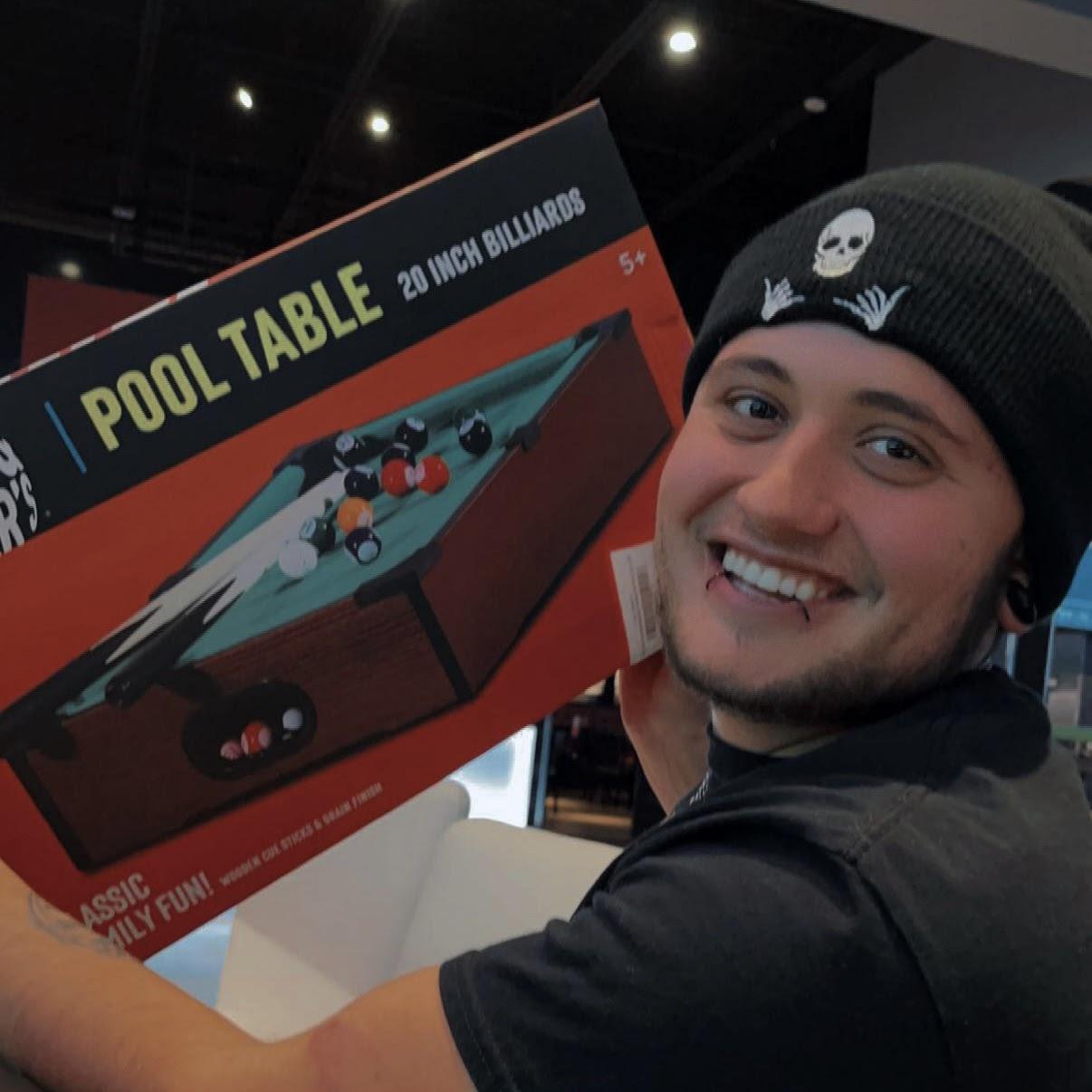 Jayden's favorite picture of Taylor.
He looks so happy and handsome. Winning the jackpot on our last few points at Dave & Buster's, we got just enough tickets to win the mini pool table.ππ€