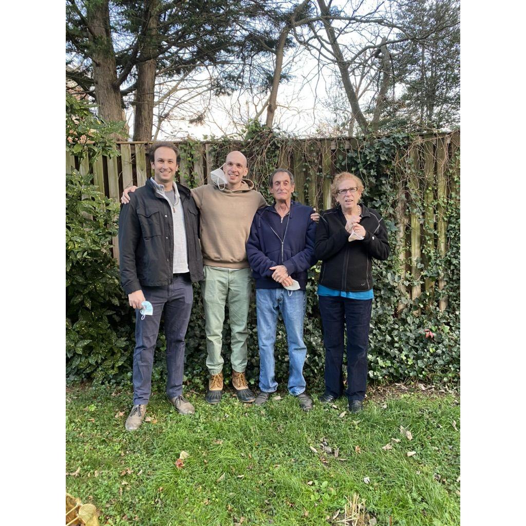 A Thanksgiving photo of Randy, David, Nathan, and Susan. Taken in peak lockdown 2020, we reflect on the unusually warm weather we had, allowing us to celebrate together safely outside.