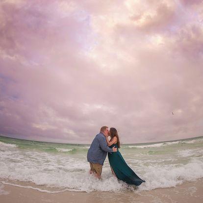The morning of our engagement pictures it was rainy and cold.  The photographer told us to walk to the edge of the water and wait for a wave to come in.  It was so cold, but we had fun!
