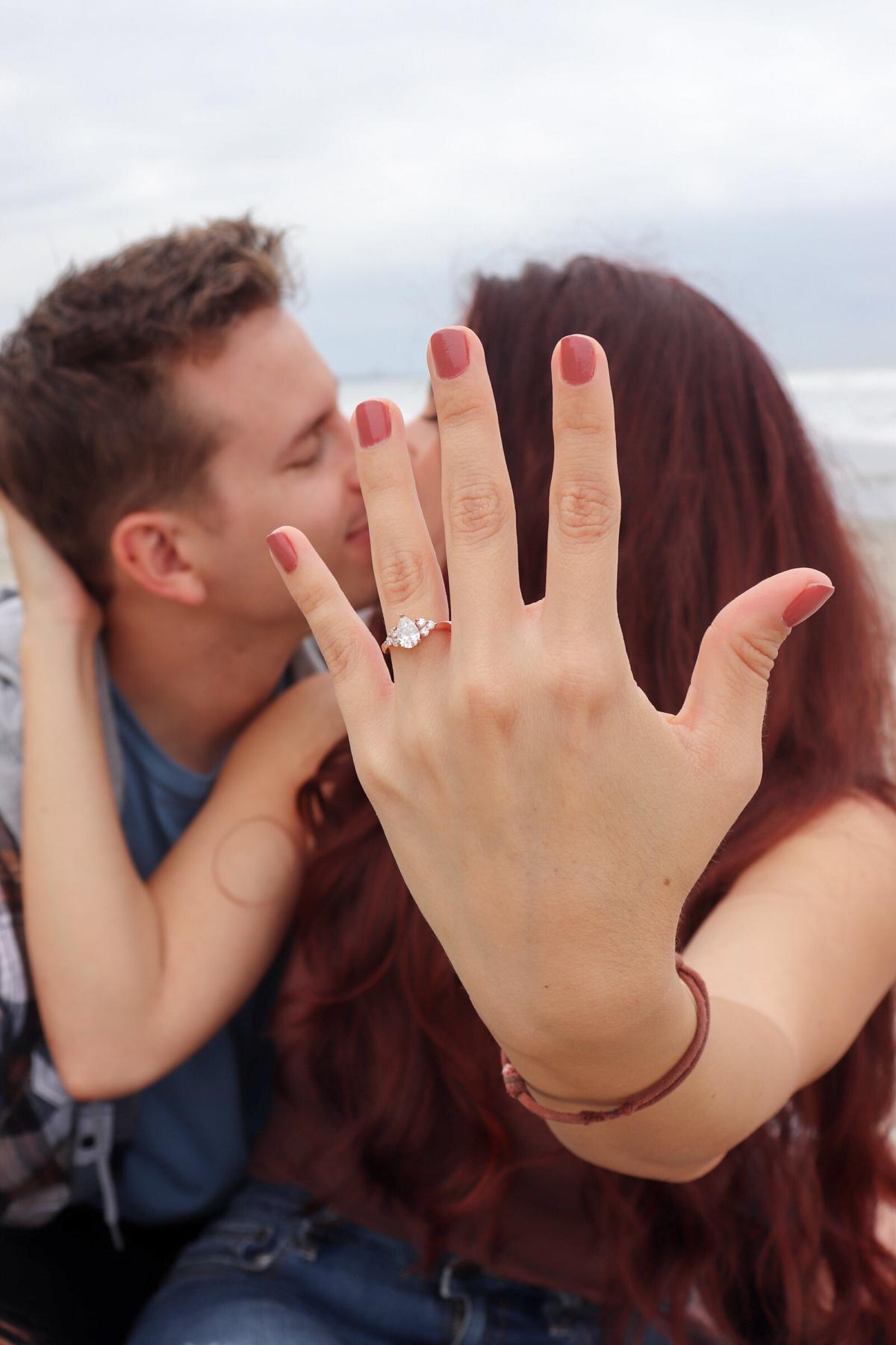 The day after Matt proposed we went to the beach to take our own announcement pictures :)