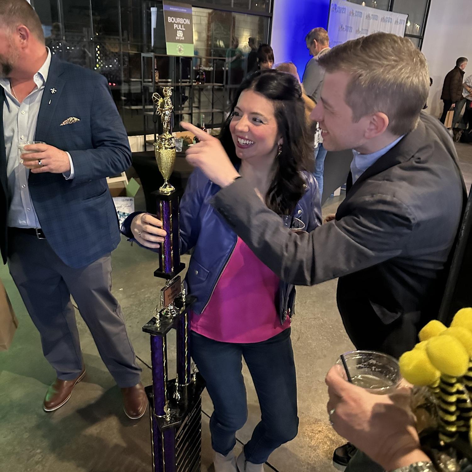 Loved this candid snapped by a friend at a fundraiser. We were noticing that the trophy is almost as tall as Lenae!