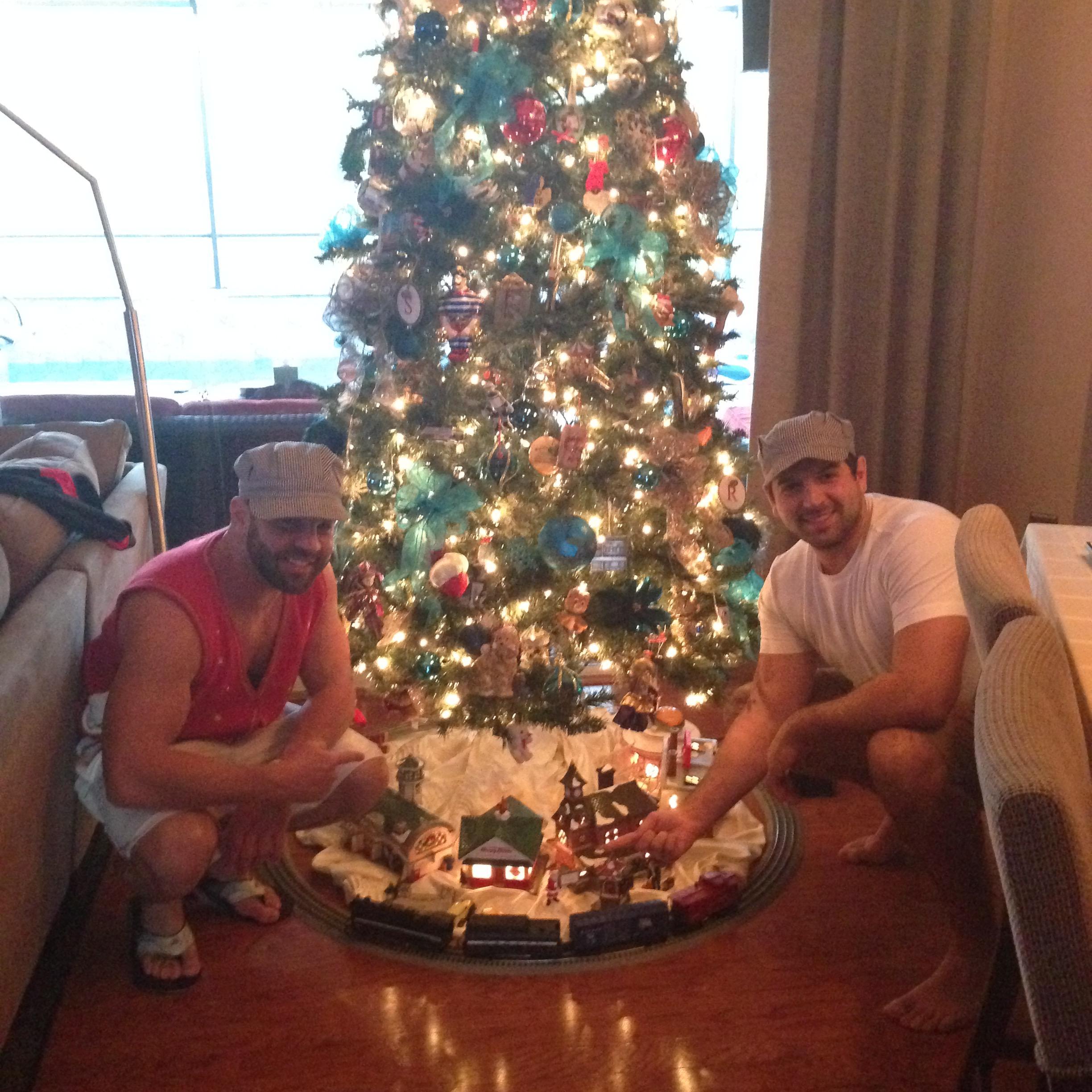 Ryan and his brother, Scott. It's a Christmas tradition since they were babies to wear conductor hats and play with the train!