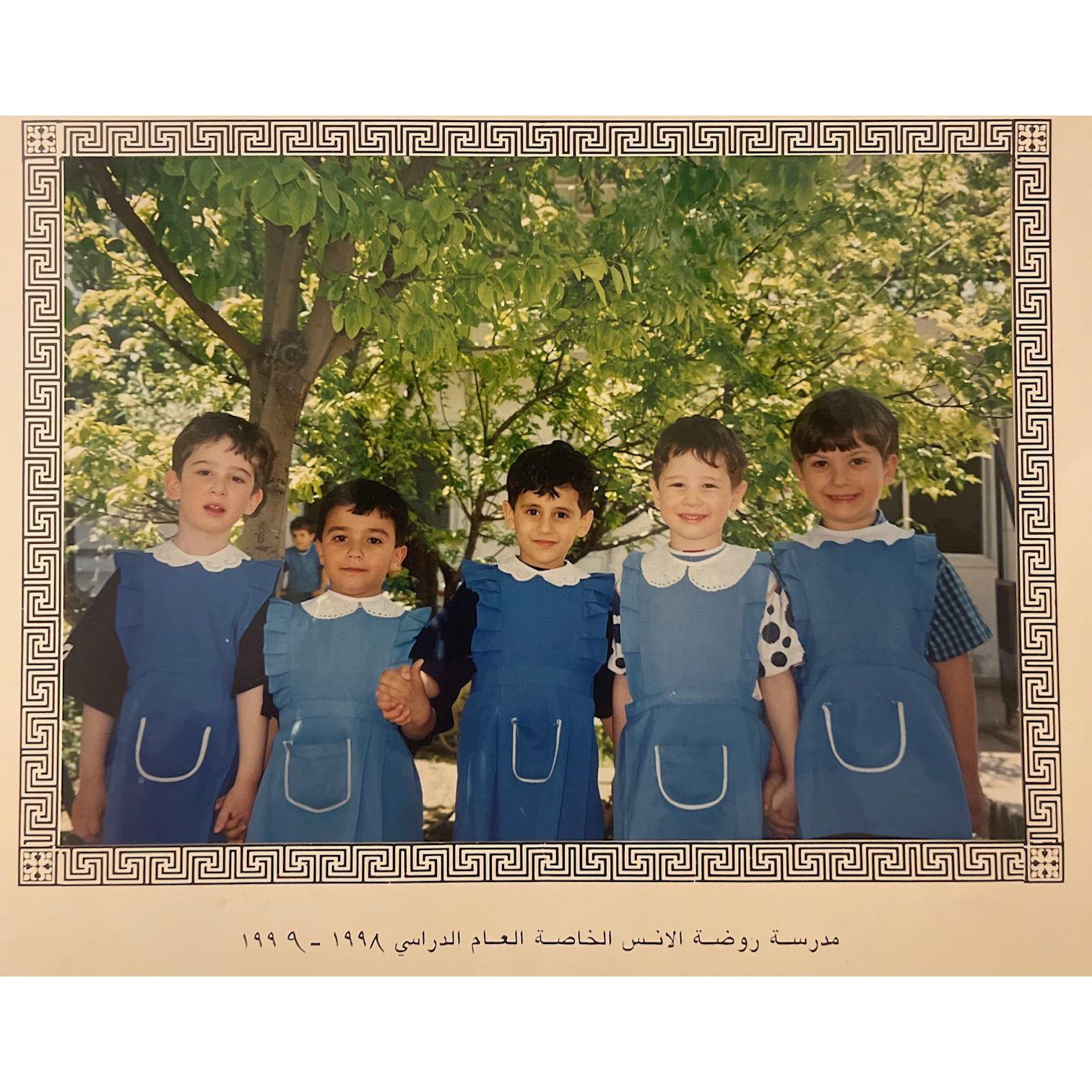 Hossam in school in Syria (middle)