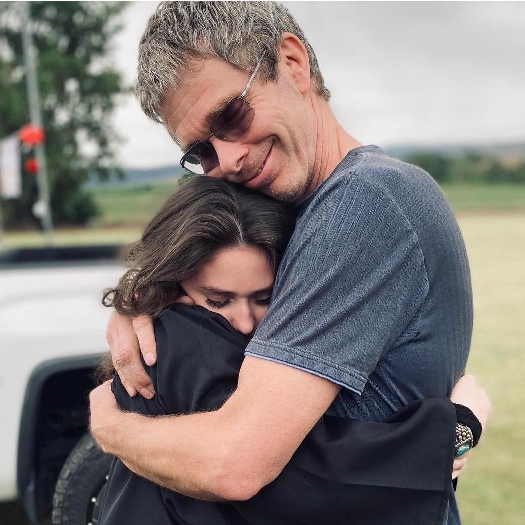 Faith and Allen (Father of the bride) hugging right before her High School Graduation