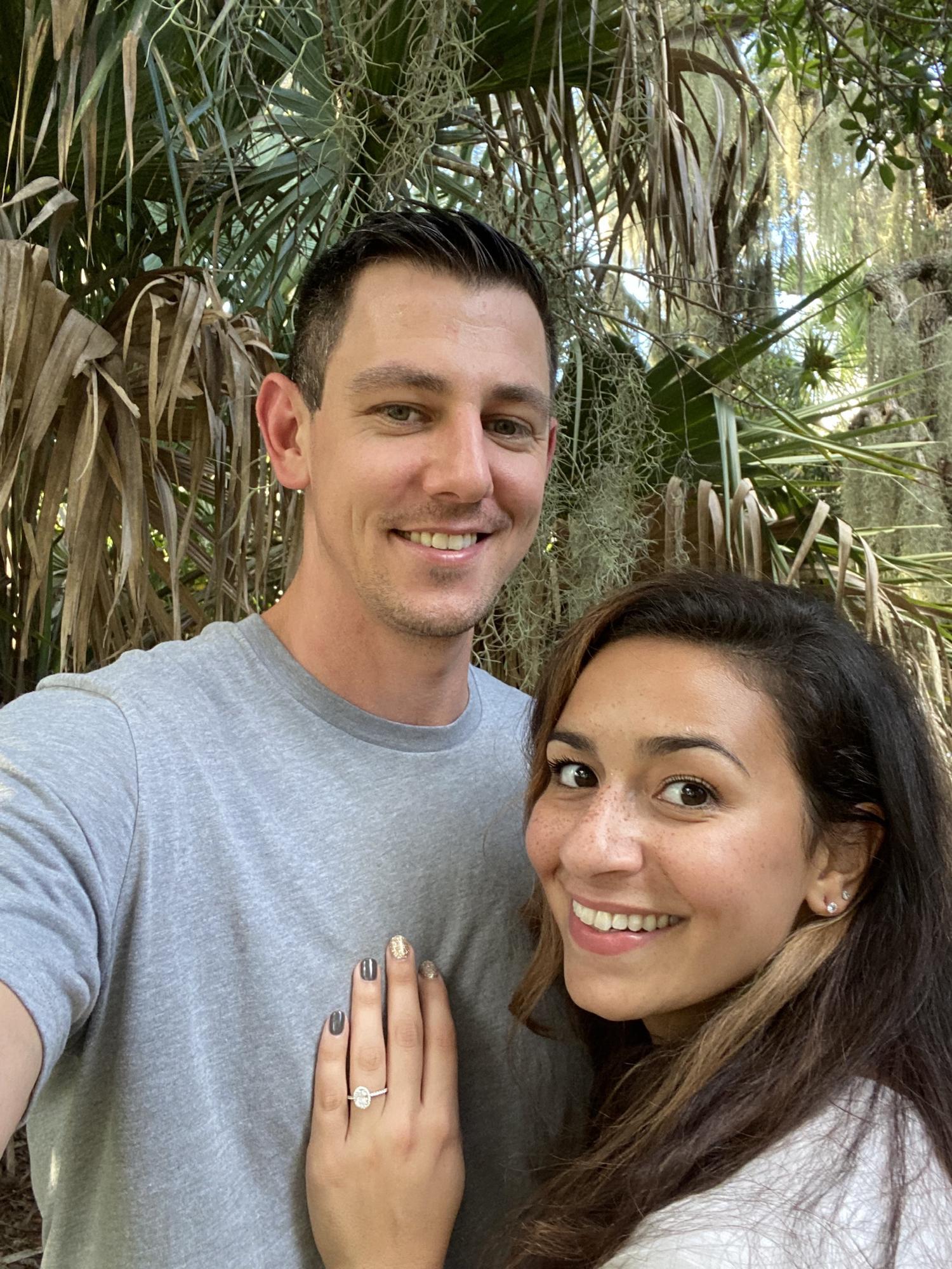 Our very low-quality first set of engagement photos right after it happened. 😂