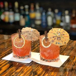 Buy Their First Cocktail with a Tiny Umbrella