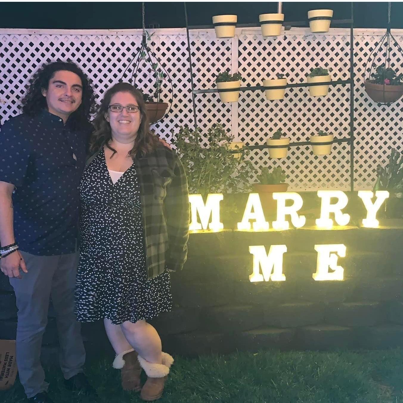 He knelt down on one knee and I said yes right before this moment was captured.