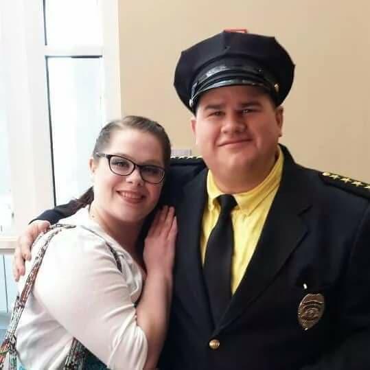 Supporting Kyle in a college production of Urinetown.