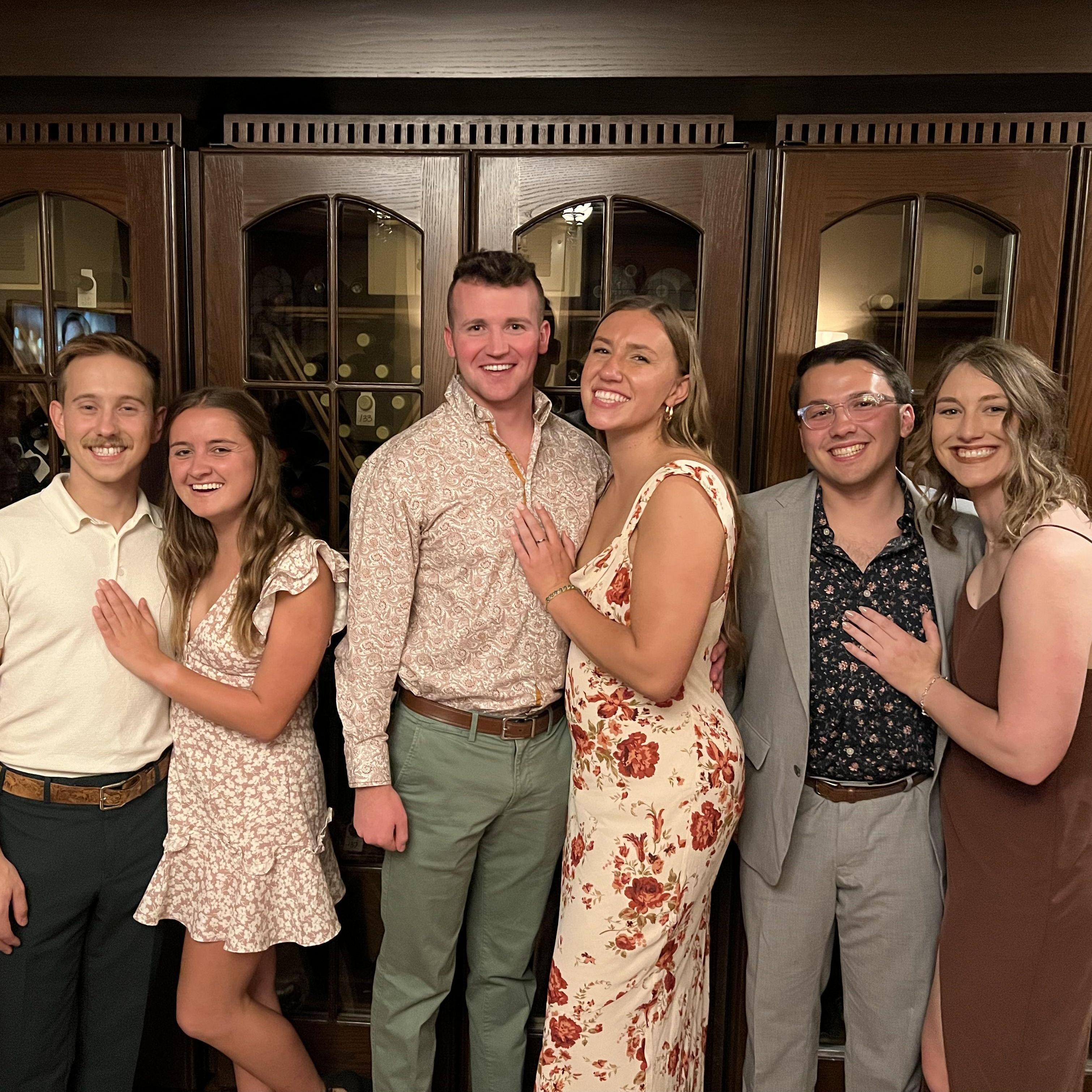 Bobby (left) & Laurel's (middle, floral dress) rehearsal dinner. We recreated the swing dancing photo from 2019.