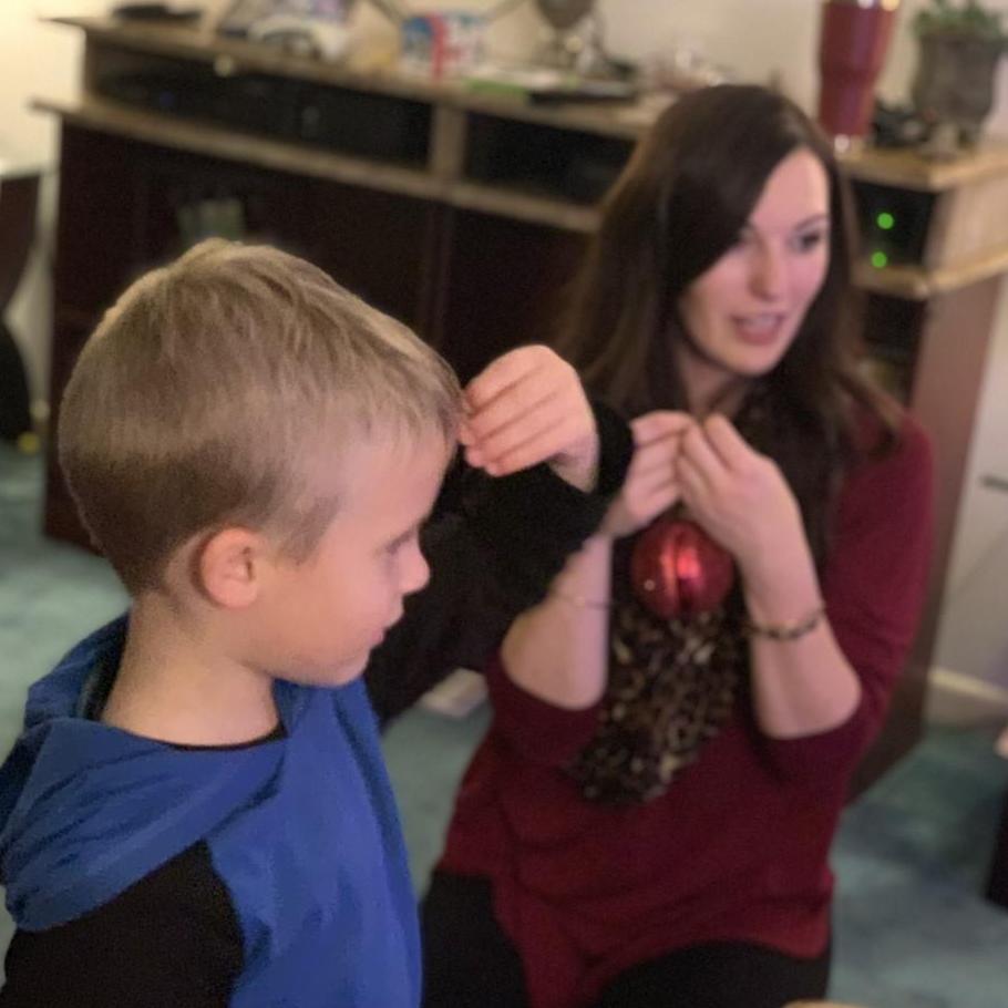 Felisha helping Chasen decorate the tree