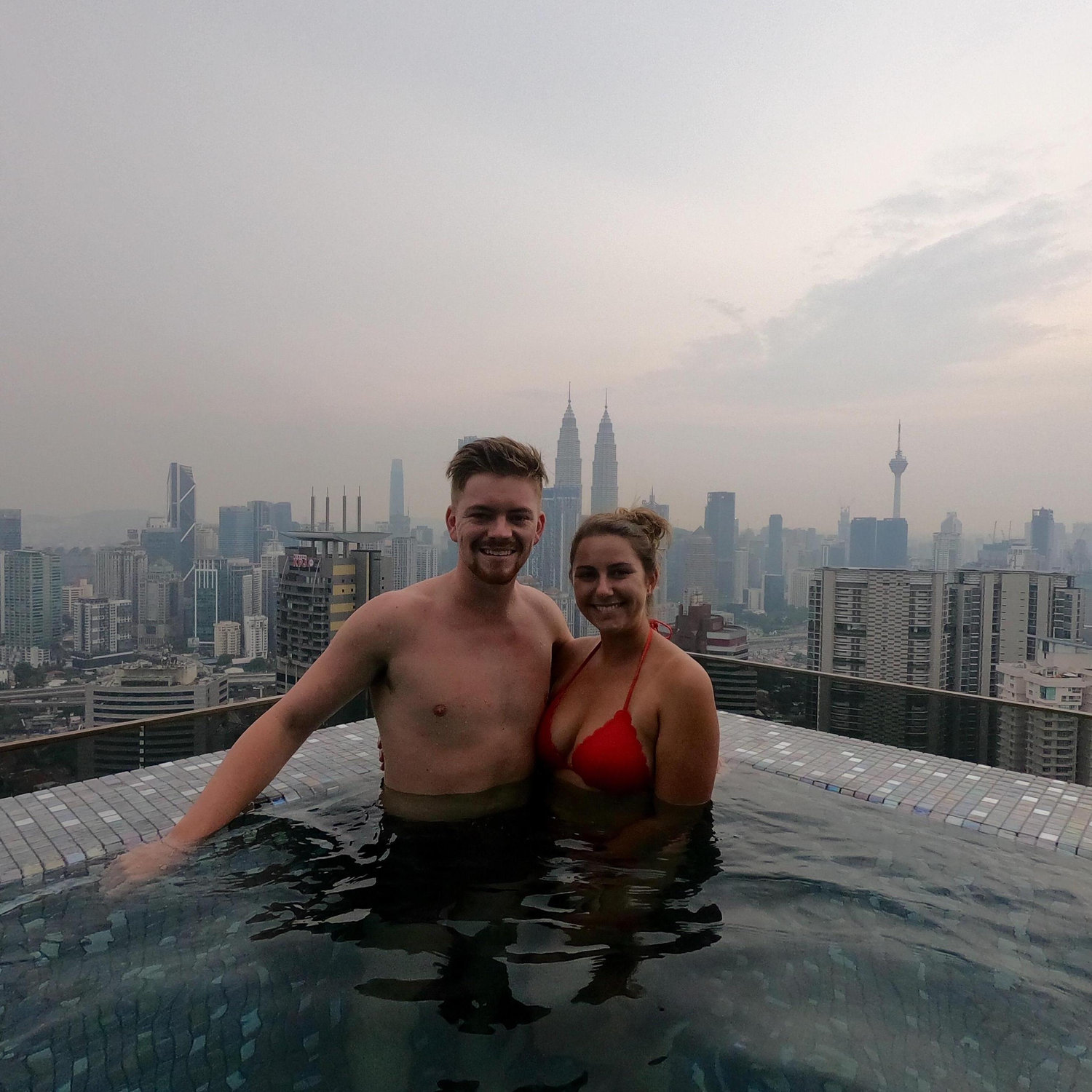 Kuala Lumpur, Malaysia
03/28/2019
After a long day of exploring KL we went back to our hotel to relax in the pool & watch the sunset. Unfortunately, it was a cloudy night but, we still a good time.