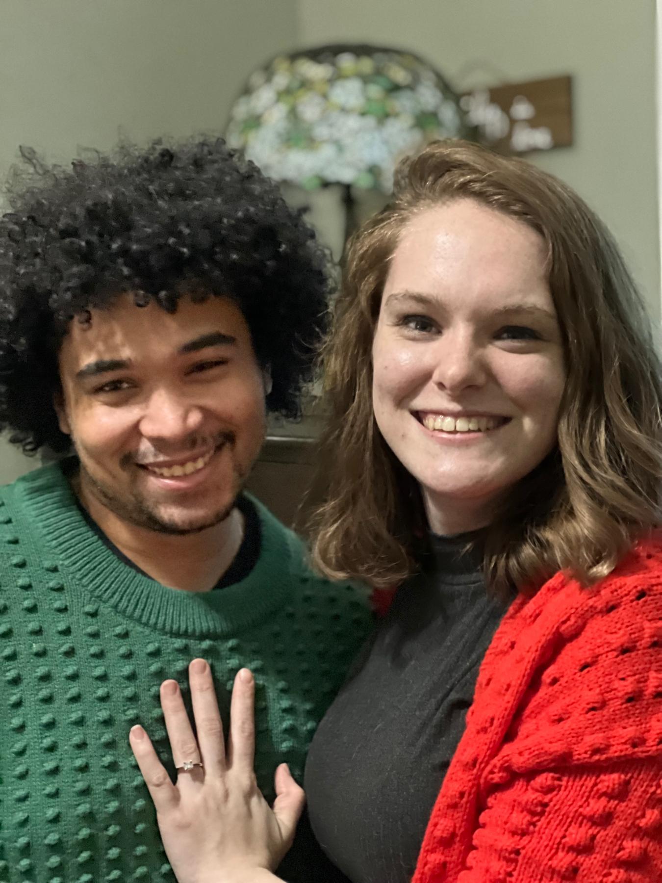 A Christmas photo from December 2021 with our matching Lego Christmas sweaters.