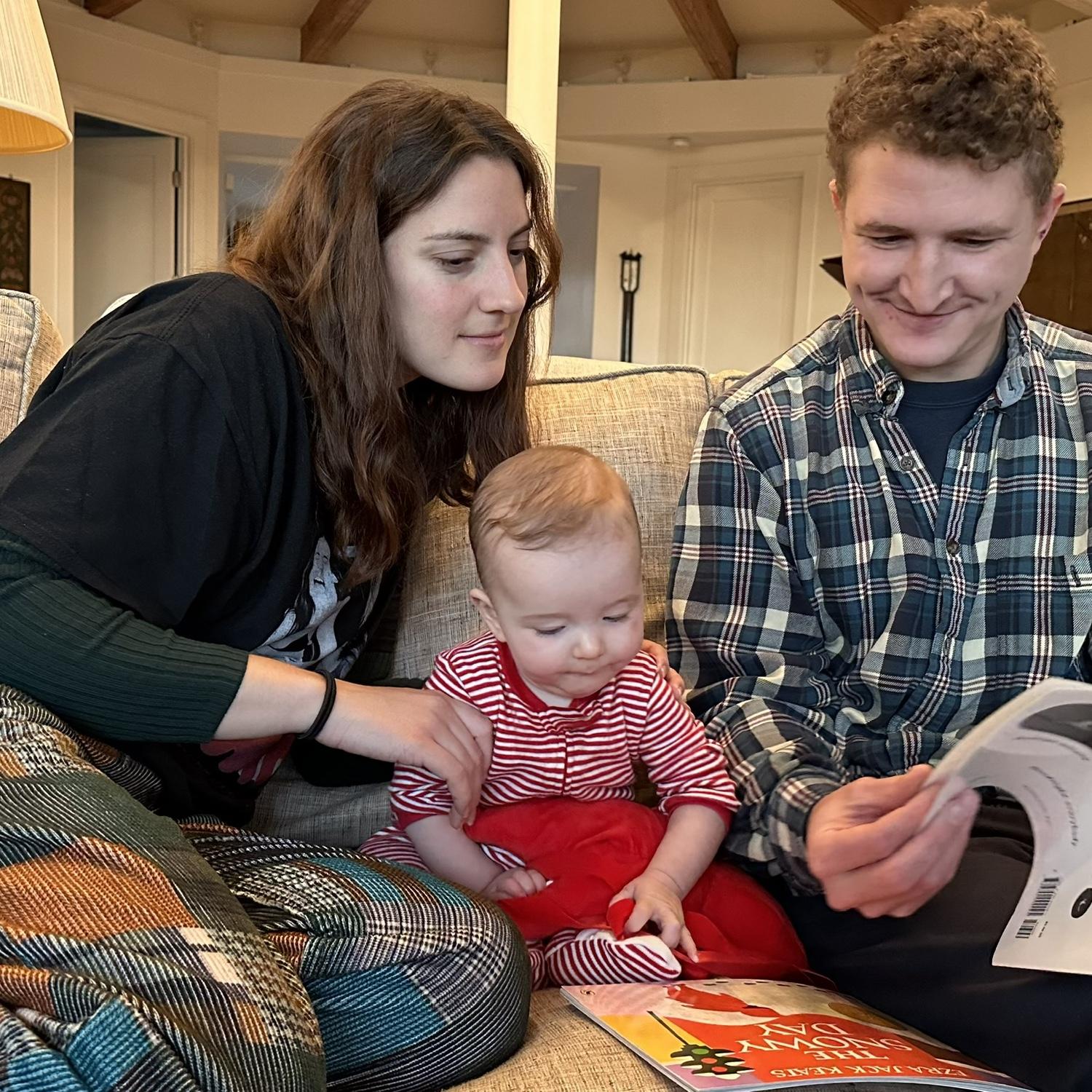 us with baby Rosie Palmer reading her a story!