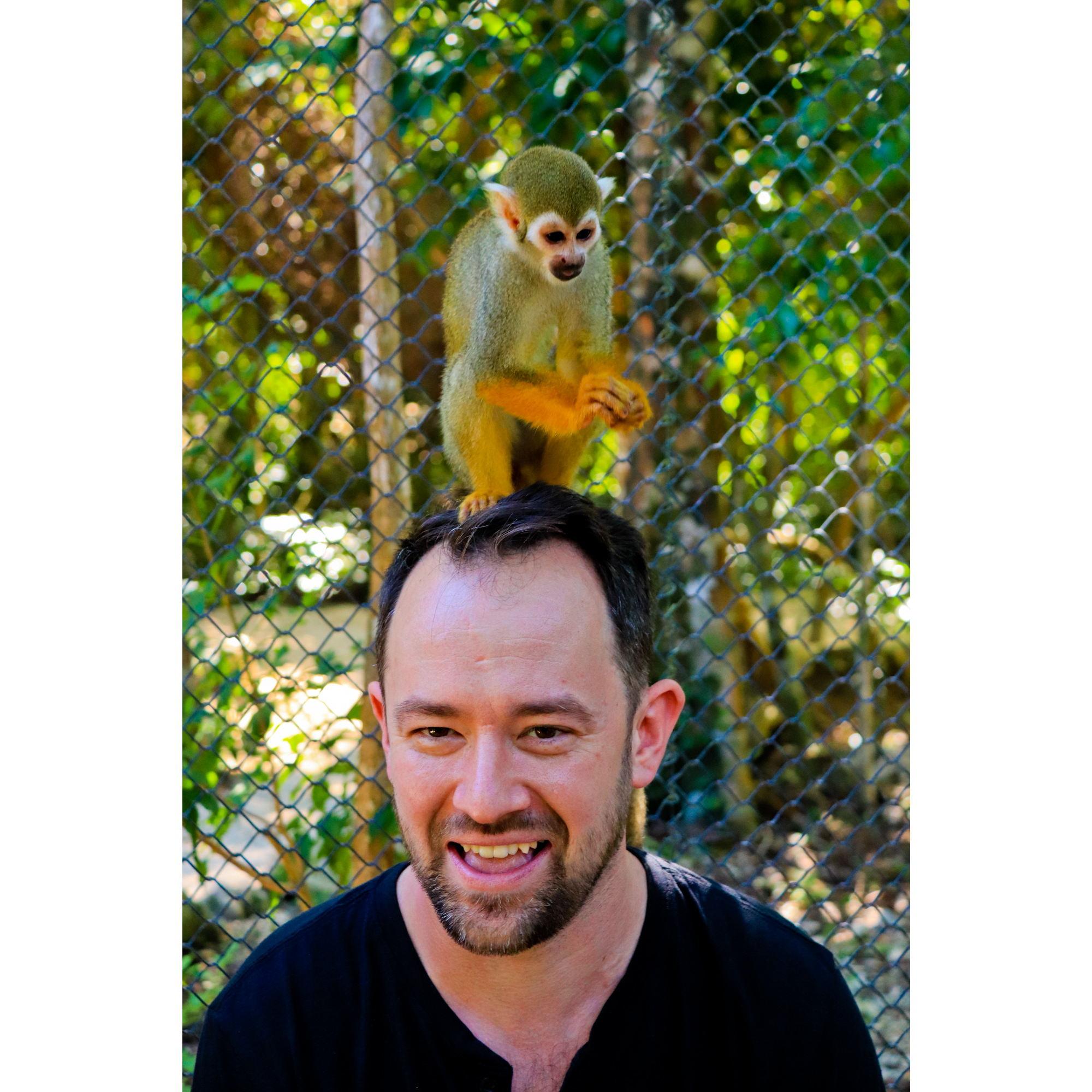 Jon with a capuchin money sitting on his head!