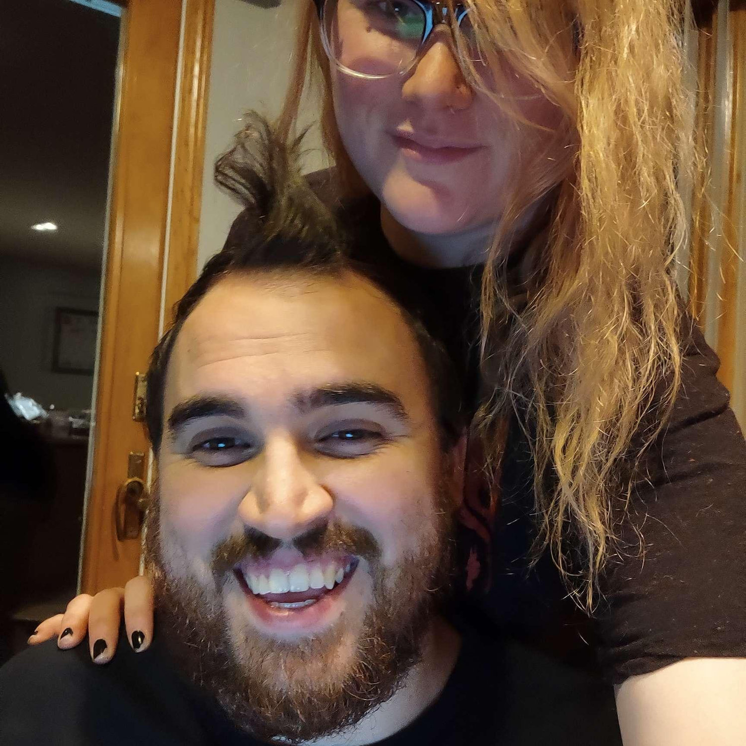 Alex was hard at work on his computer, while Arliss was hard at work making his hair look amazing. She snapped a photo to help him relax.