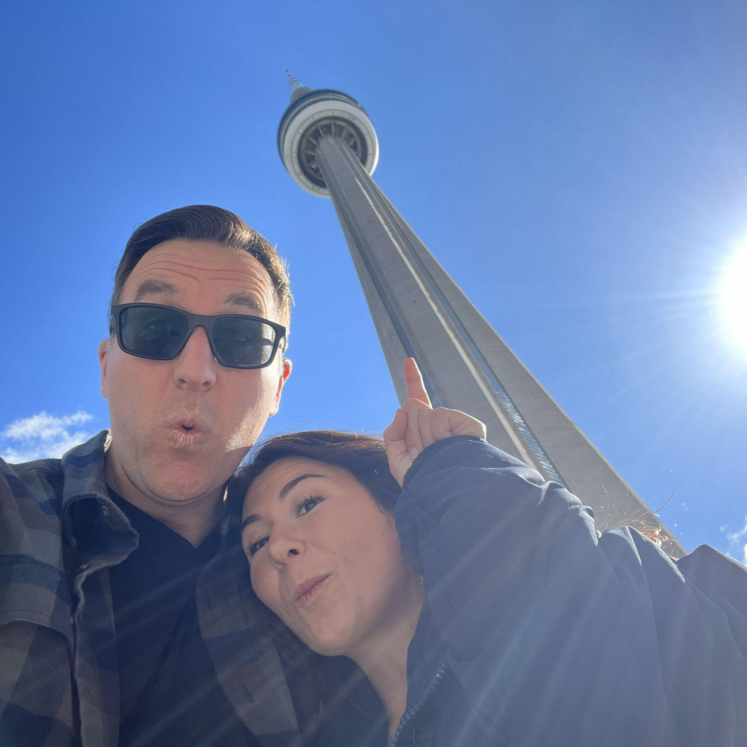 Visiting Canada for Paulina's first time. The moment before we climbed to the top of the CN Tower, and stood on the outside of it at the top of the world!