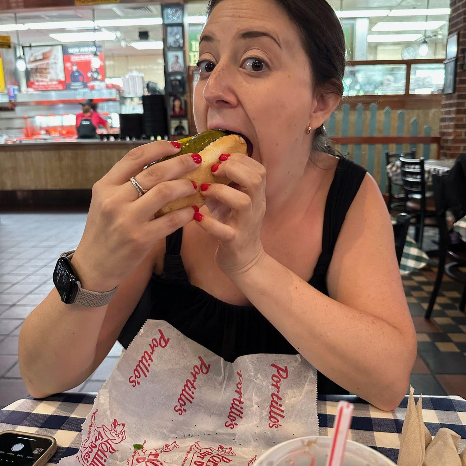 L back on home turf, devouring a Chicago-style hot dog the only way it should be—no ketchup, all attitude.