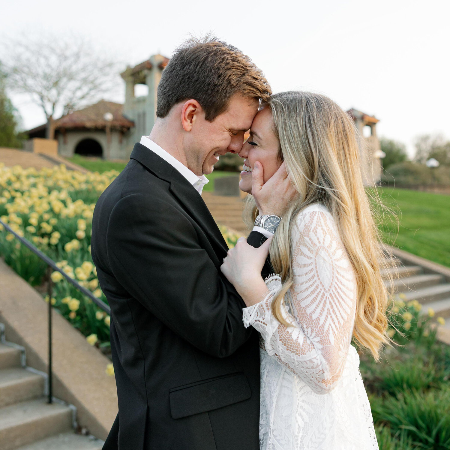 An engagement photo in front of the World's Fair Pavilion