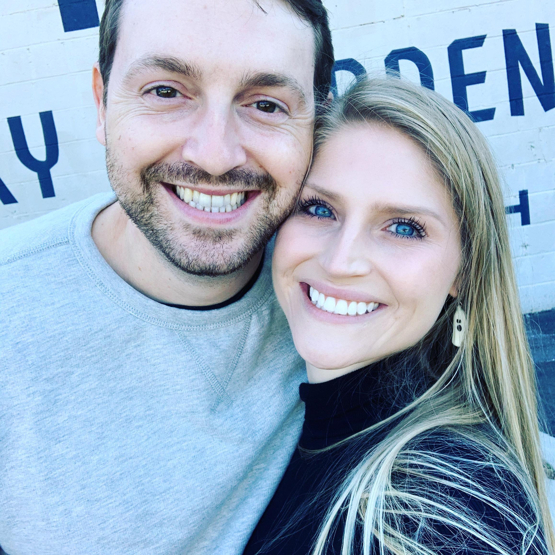 A picture of the couple after saying "yes" to the venue.