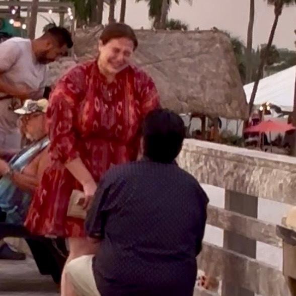 After hyperventilating and bursting into tears immediately, Gina said yes.