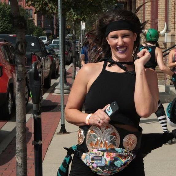 The day we met. 
Sadie was faster than Nick, that's why he's not in the picture. This was one of very few photos that day, but the big hair and wrestling belt were the start of many more adventures.