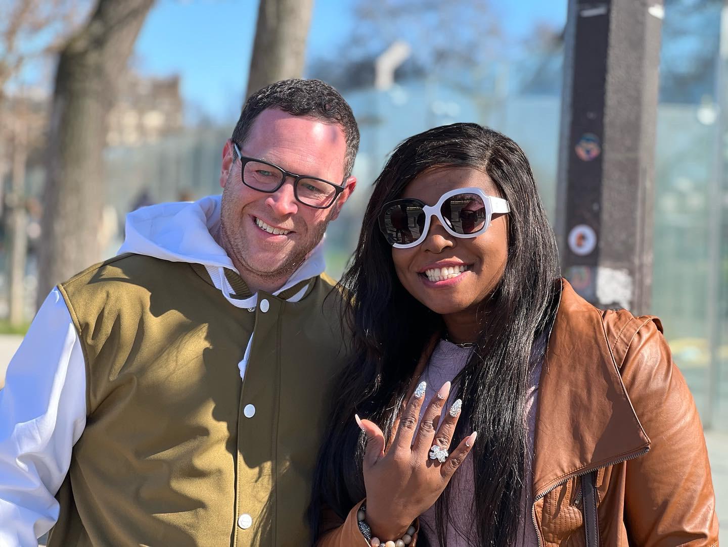 Near Eiffel Tower where Tyler proposed and Enny said a big YESSSS