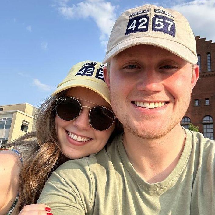 Smiling after Grace graduated near Memorial Union Terrace. May 2023.