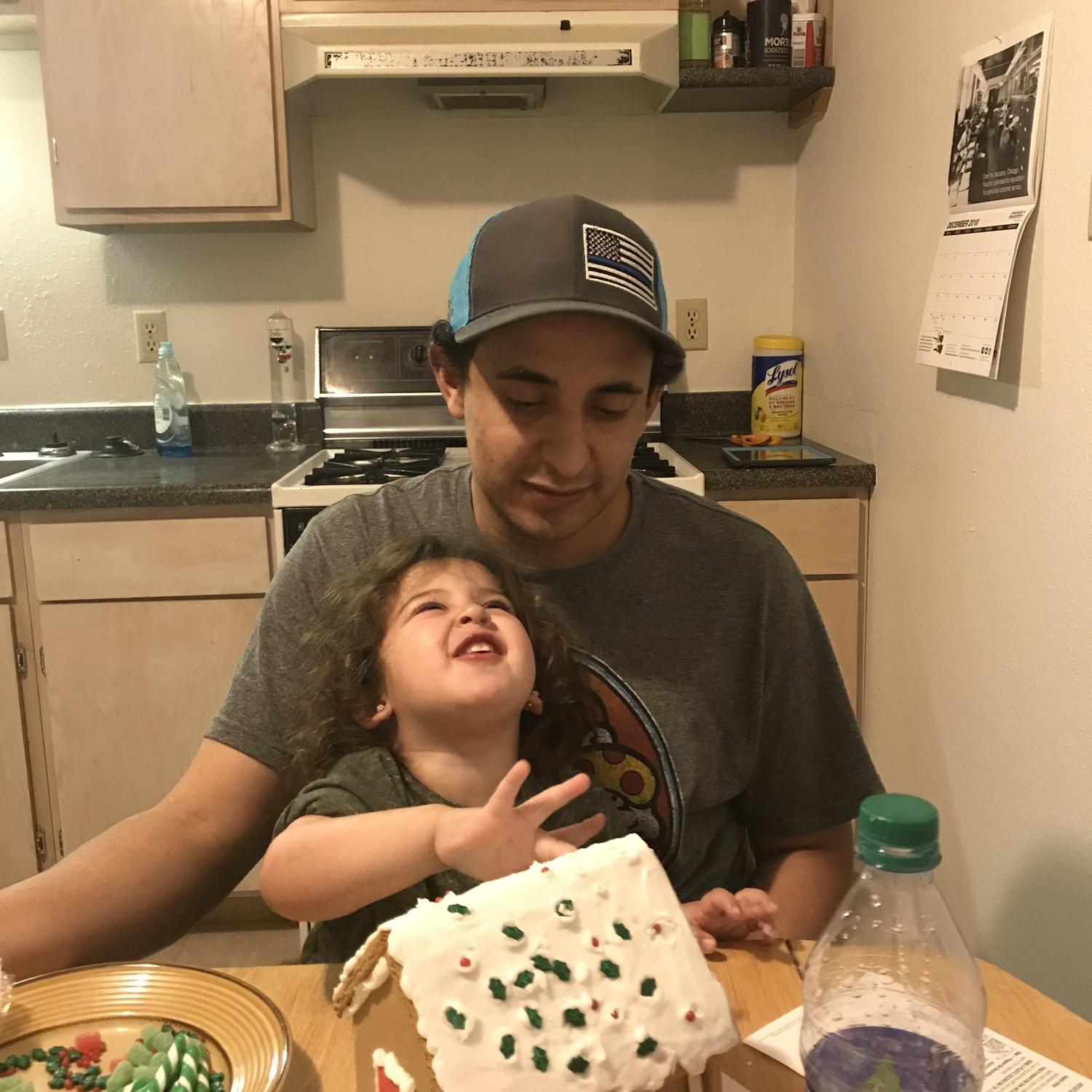 Making a gingerbread house before our first Christmas together. This is one of MO’s favorite pictures of these two!