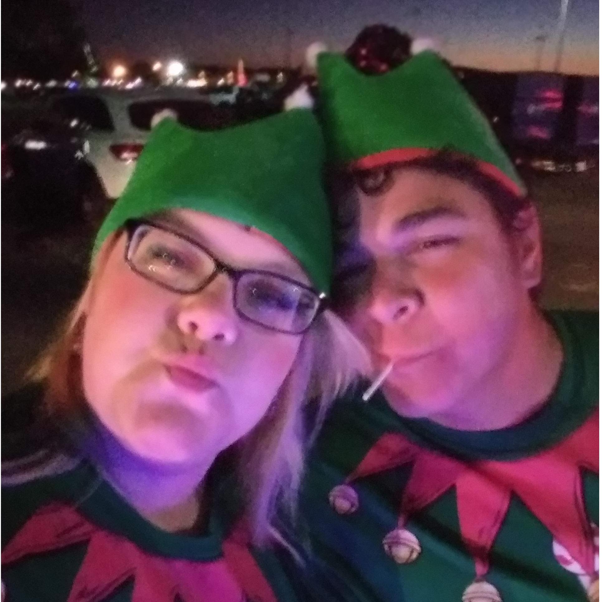 Jubal and Terri as Royal Plumbing Christmas parade elves. Terri died after walking and running the parade route. Jubal is marrying a ghost.