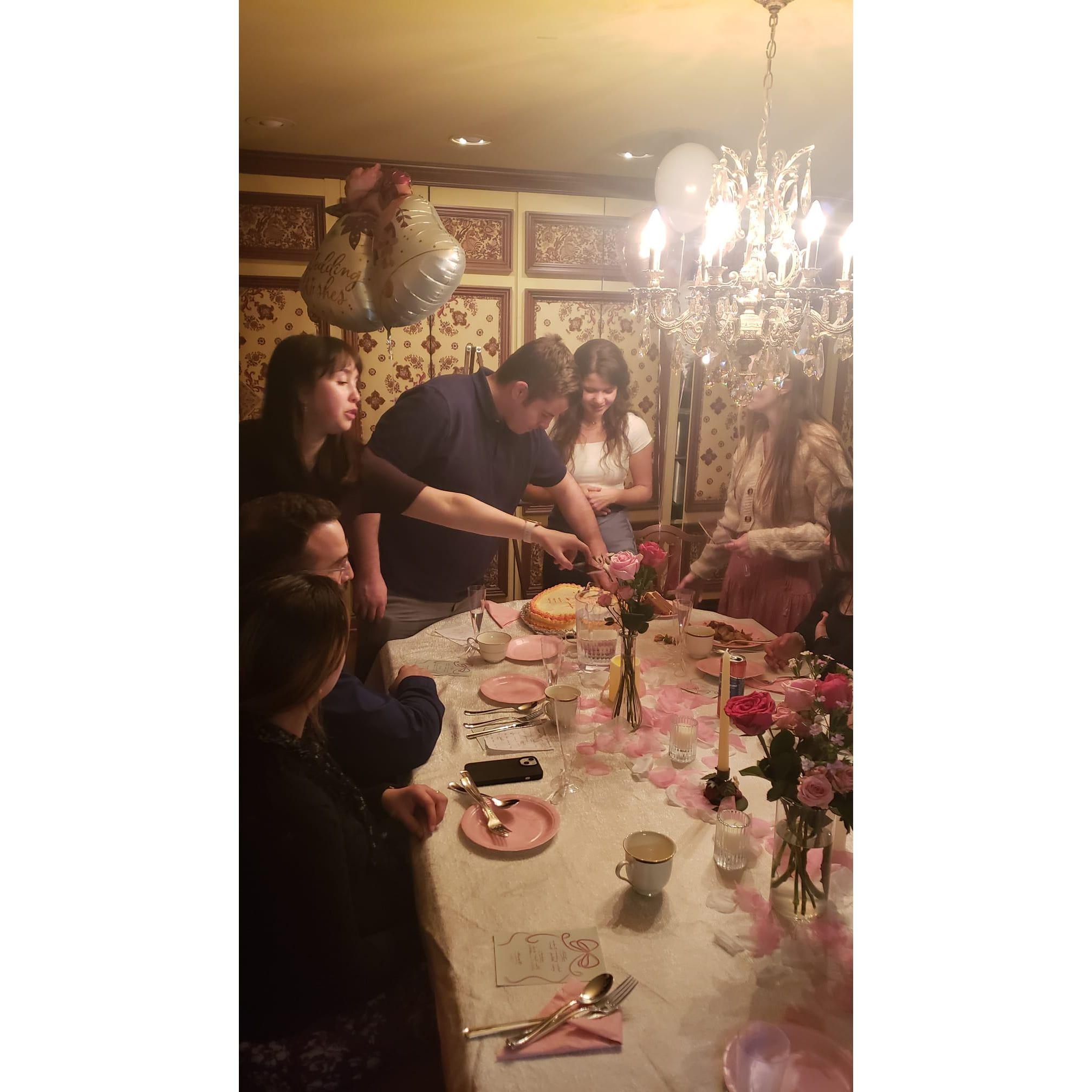 Cutting the cake at our engagement party. 3/18/24