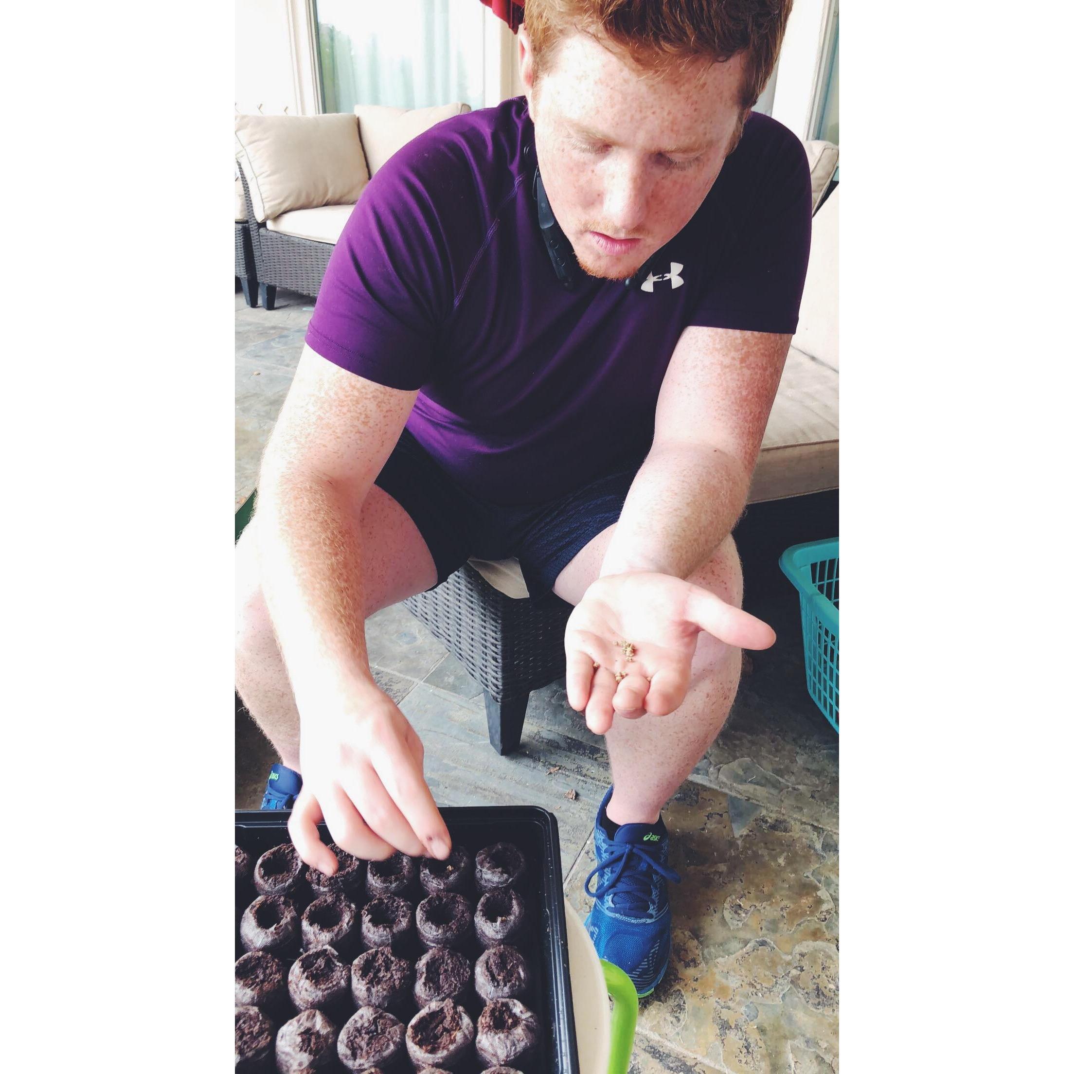 2018 - Shiloh helping plant seeds in Em's garden...the same one he would later propose in!