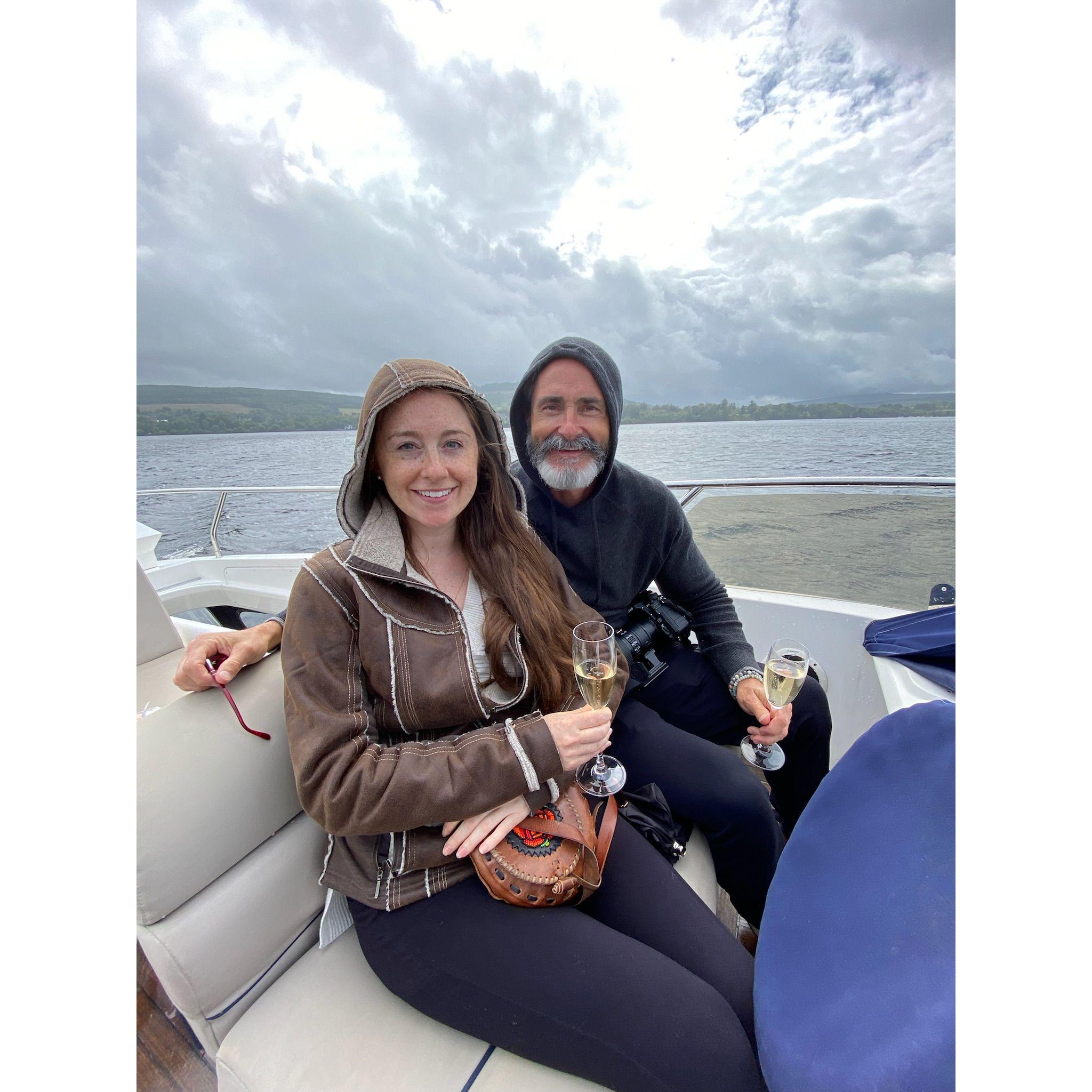 Cheers! Enjoying a boat tour on Loch Lomond in Scotland