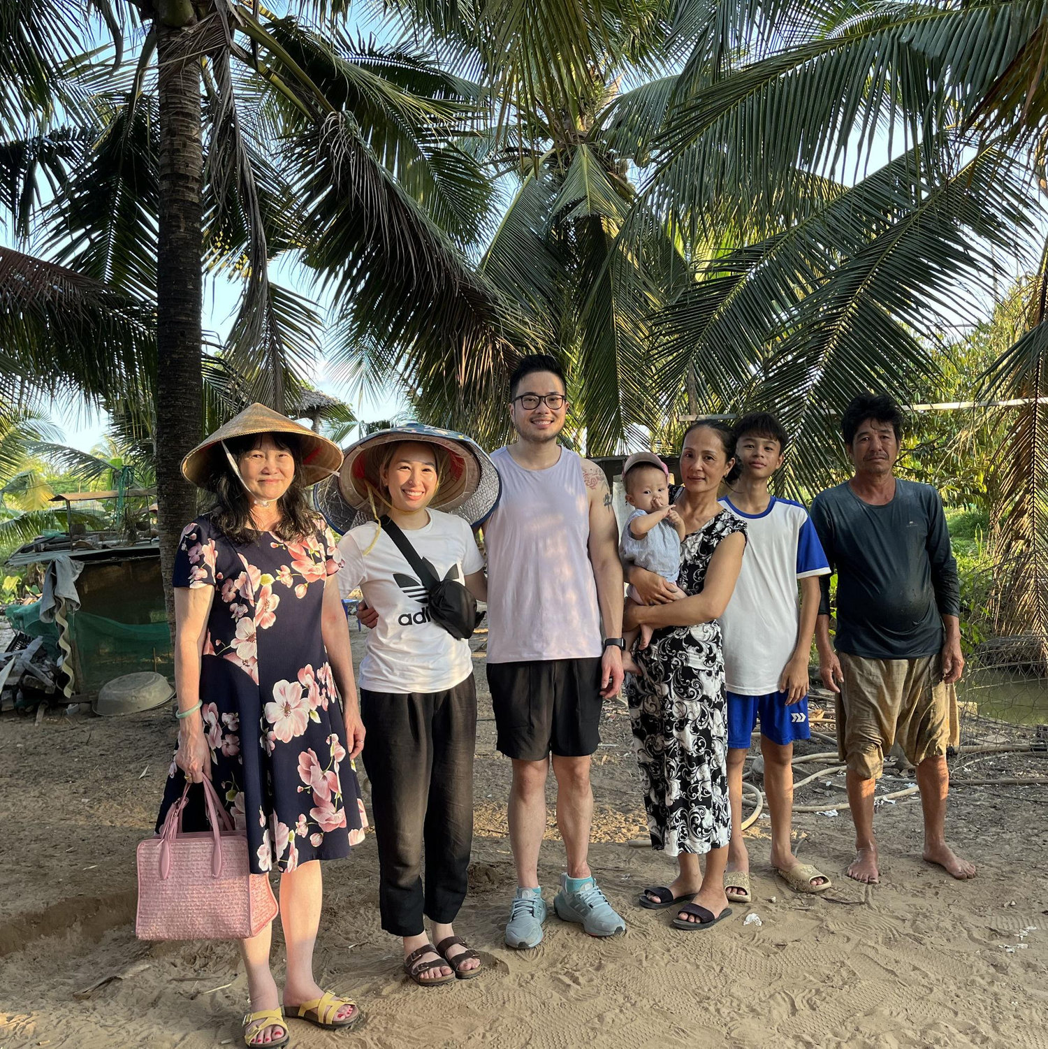 Wa's mom visiting my family's farm in Vietnam.