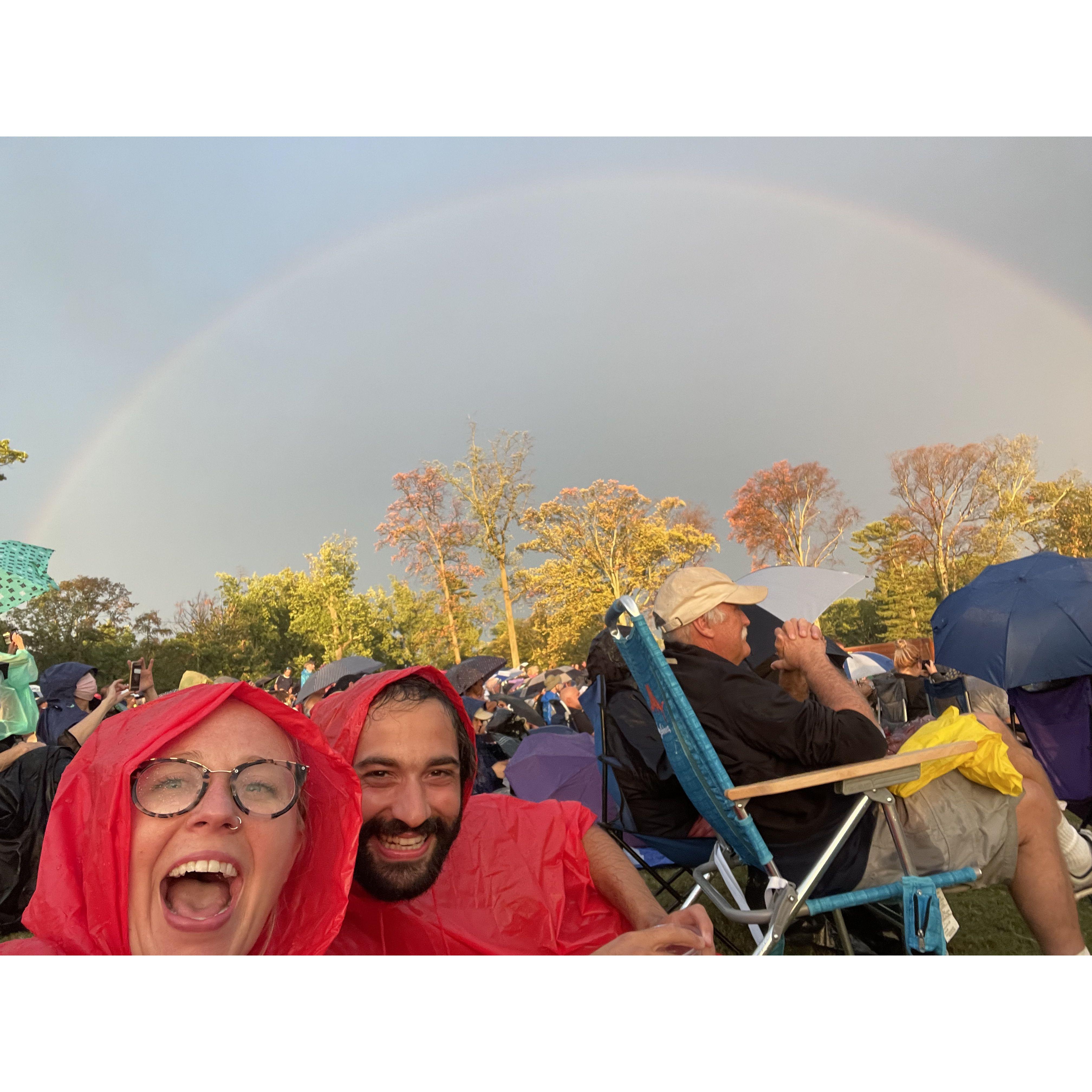 Annie and Bobby go to a concert. It rains a lot but there is a rainbow so it was perfect. (Also MaTcHiNg ponchos.) August 2021.