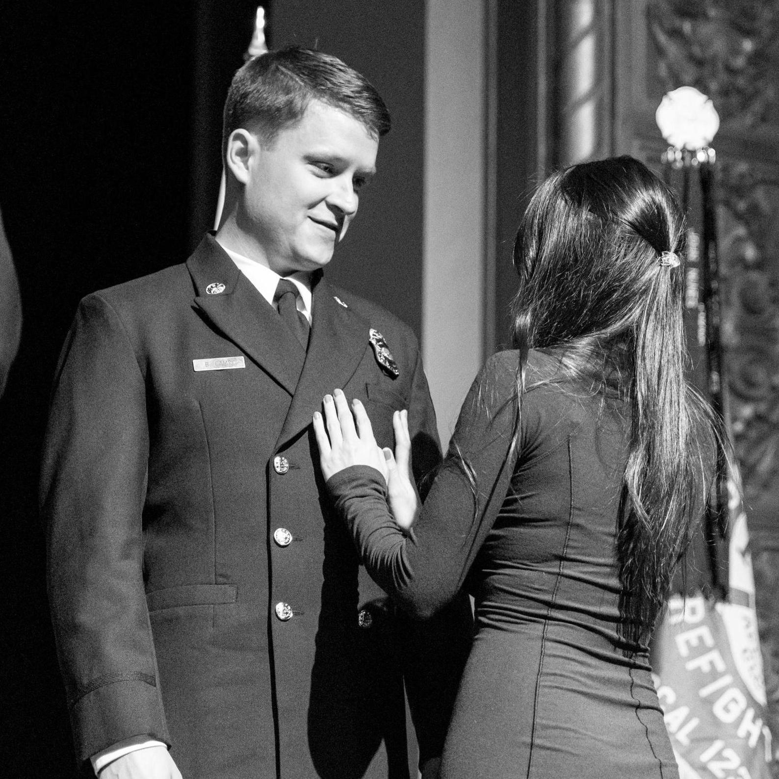 Pinning Ben at his firefighter graduation