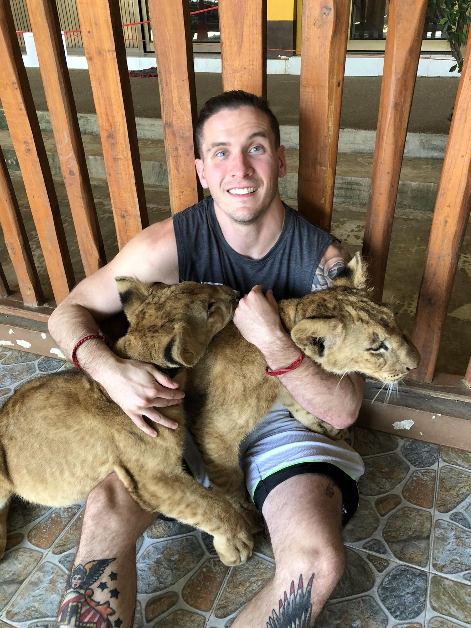TJ in Thailand playing with baby lion cubs coz why not?! 😆