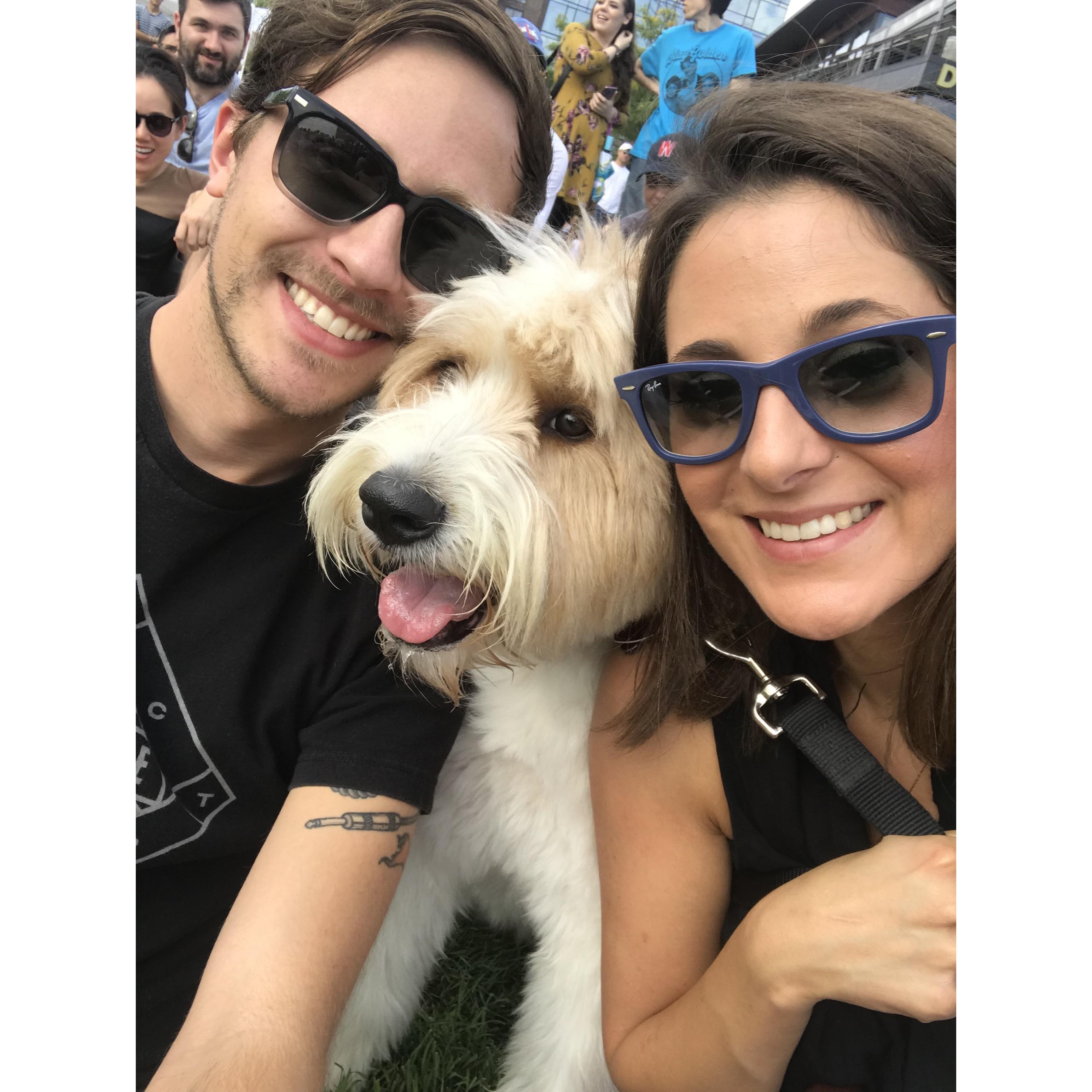 We took this super cute pic at the wiener races. That couple in the blue shirt/yellow dress would sit down in front of us and LE basically cuddled them the whole day and made us feel worthless.
