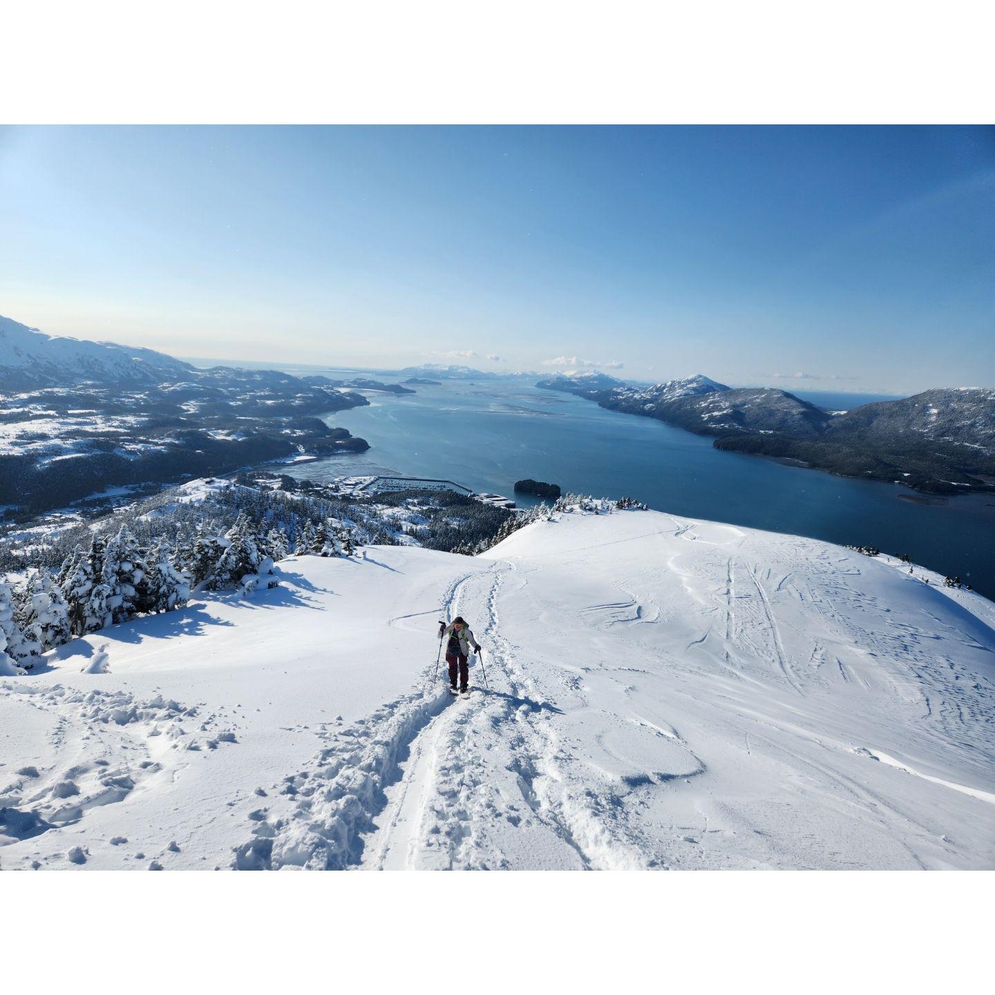 Noelle skinning up Mt Eyak on a bluebird day
