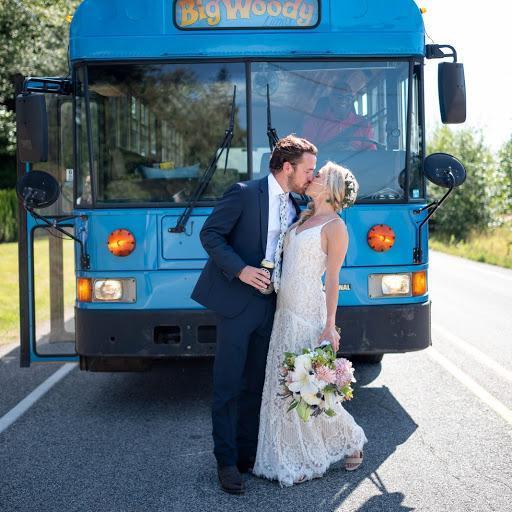 Kisses in front of the 'Big Woody' before heading to Fort Ebey State Park for the ceremony
