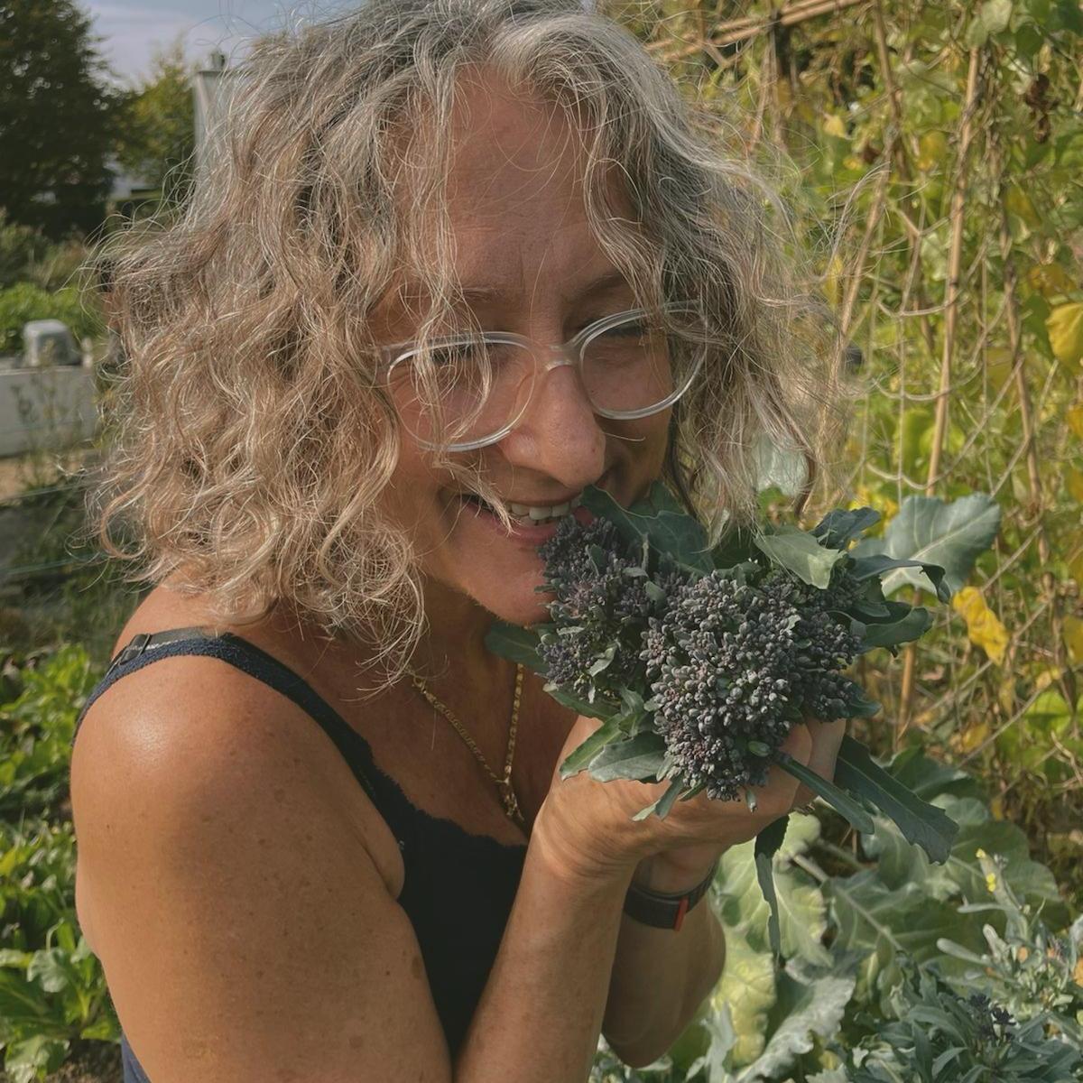 Mum showing the world her love for home grown purple broccoli.